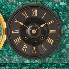 Egyptian Revival Malachite, Marble, Gilt and Patinated Bronze Clock Set