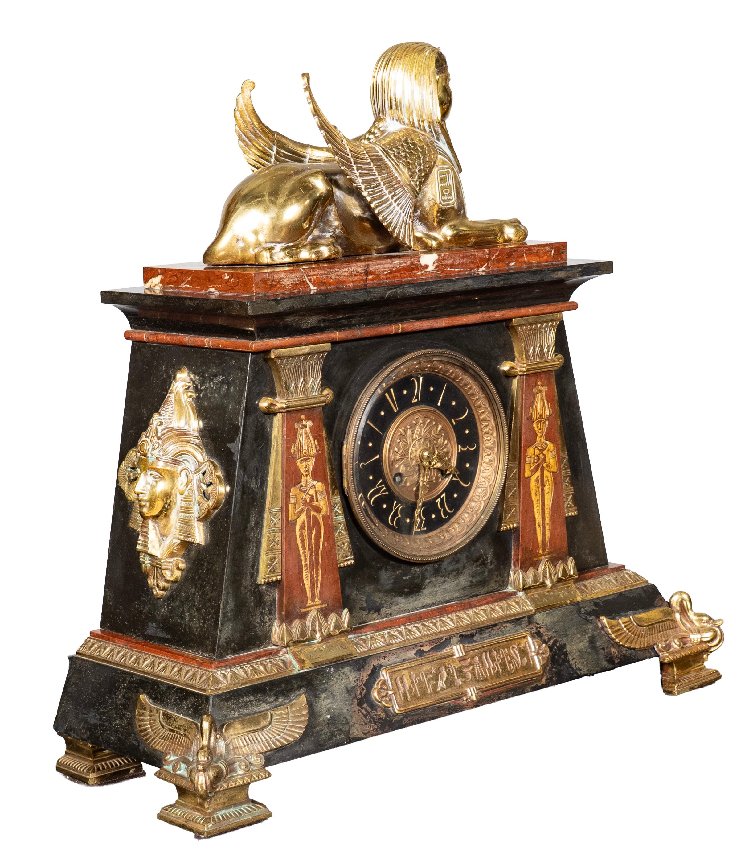 A TIFFANY & CO. EGYPTIAN REVIVAL MANTLE CLOCK, AMERICAN, 1880s,
a bronze ormolu and marble clock made by L. Marti et Cie for Tiffany & Company, marked on clock face, 