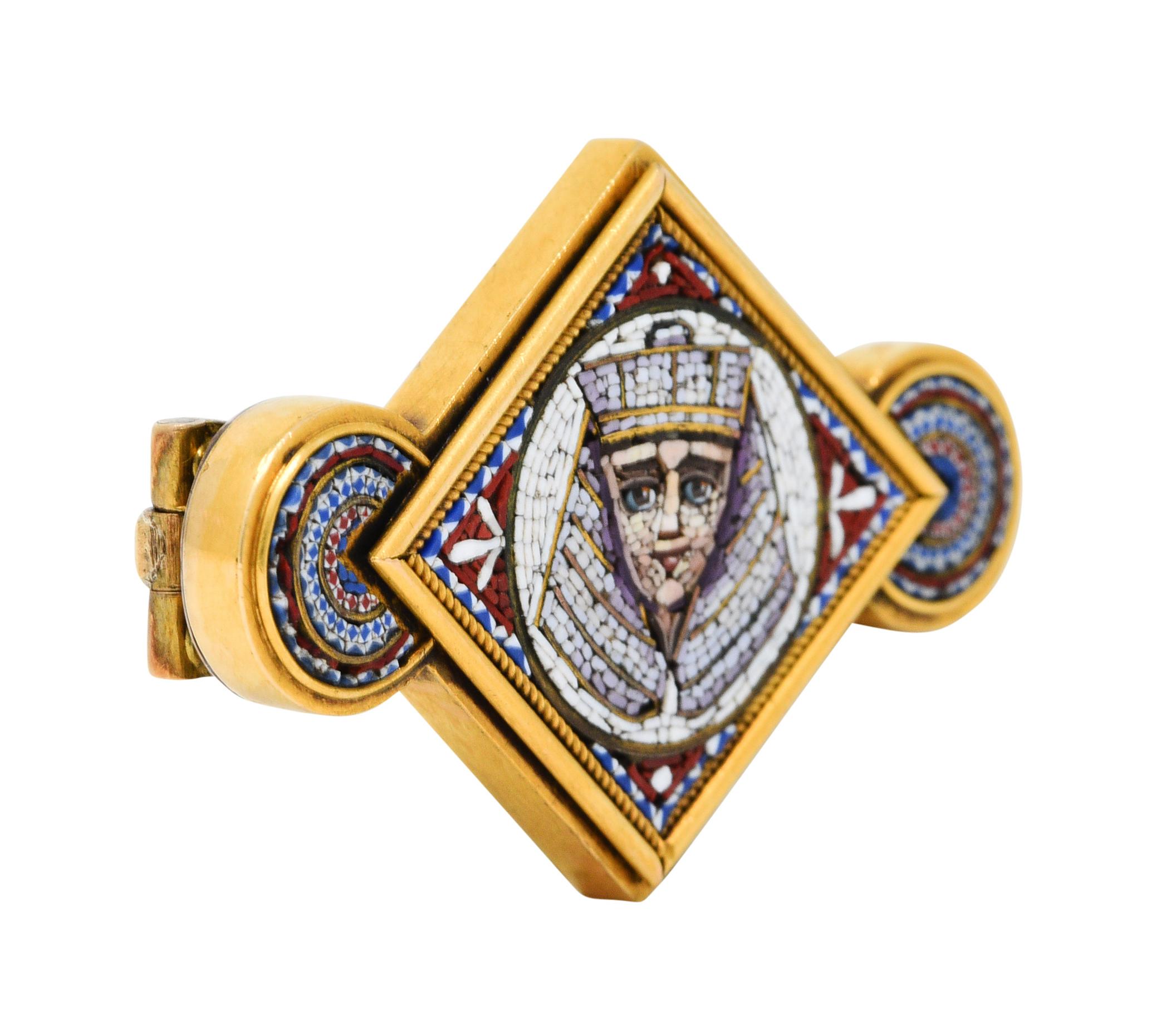 East to West brooch centers a navette form flanked by circular forms

Depicting an ornate micro mosaic image of a Pharaoh and intricate concentric patterning

With a subtle twisted rope surround

Completed by a pin stem and closure

Tested as 18