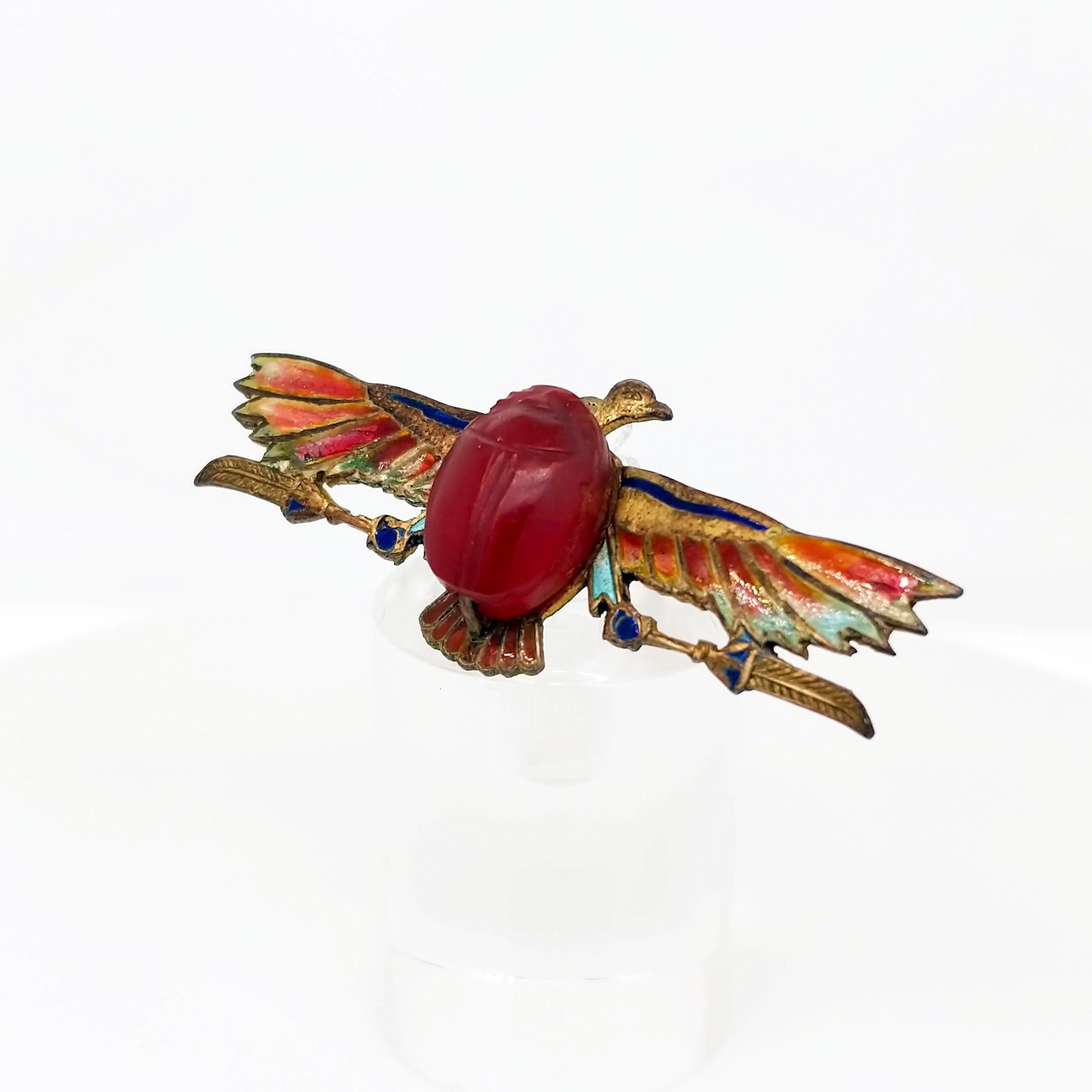 This pin is quite the piece! This Egyptian Revival pin features a lovely scarab in the center made of carved carnelian! The wings on this eagle are gorgeous plique-a-jour enamel - a technique that makes the final product translucent! As there is no
