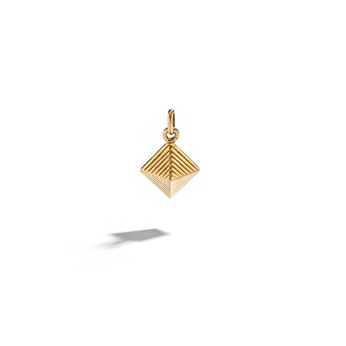 Pyramid Yellow Gold 18k Charm.
Egyptian Revival.

Total height: 0.79 inch (2.00 centimeters) including bail.
Total weight: 5.22 grams.