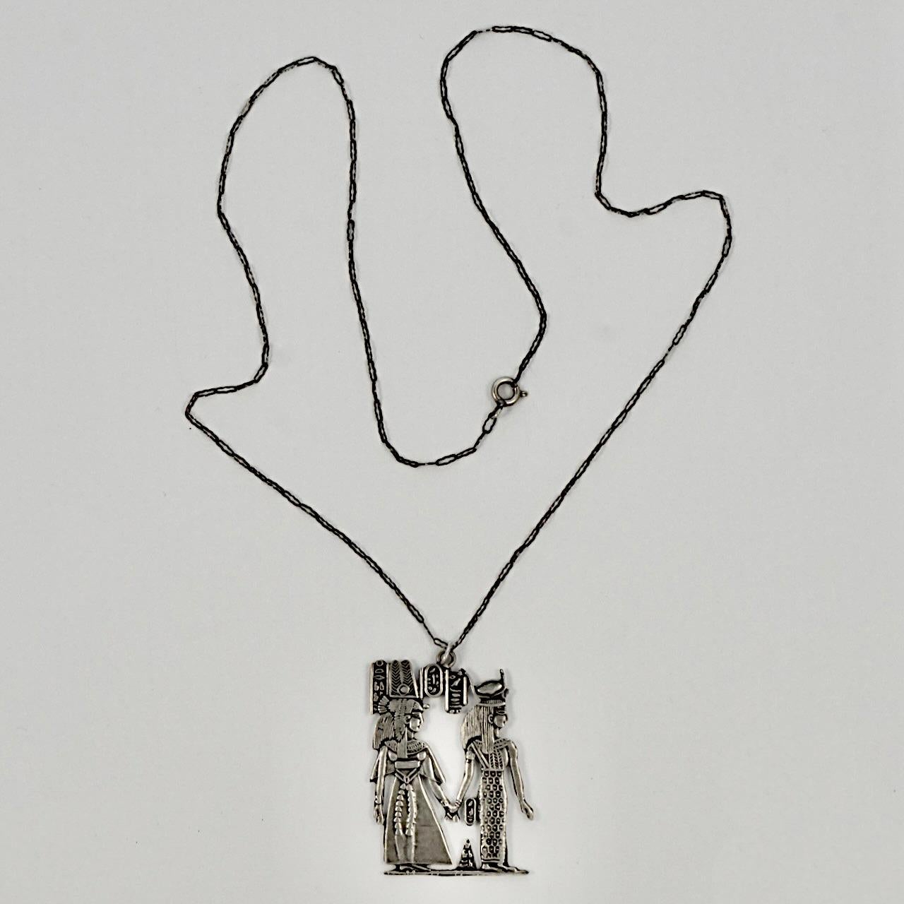 Beautiful Egyptian Revival silver pendant with Egyptian hallmarks, hung on a silver paperclip design chain. The pendant measures length 4.3 cm / 1.69 inches by width 3.1 cm / 1.2 inches. The chain is length 54.5 cm / 21.45 inches. Both the pendant