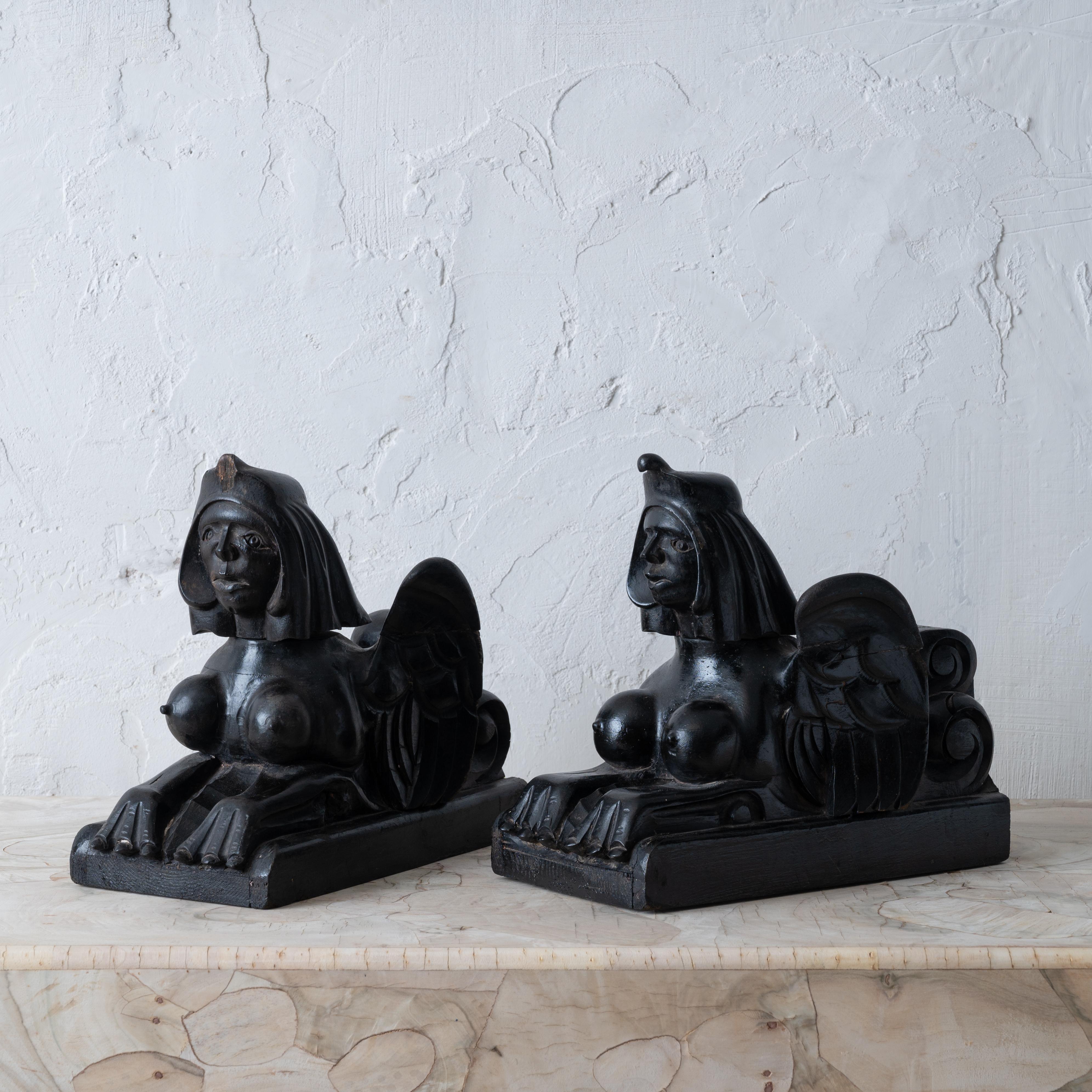 A pair of Egyptian Revival ebonized sphinx carvings, circa 1880.

6 ¼ inches wide by 12 inches deep by 10 inches tall

