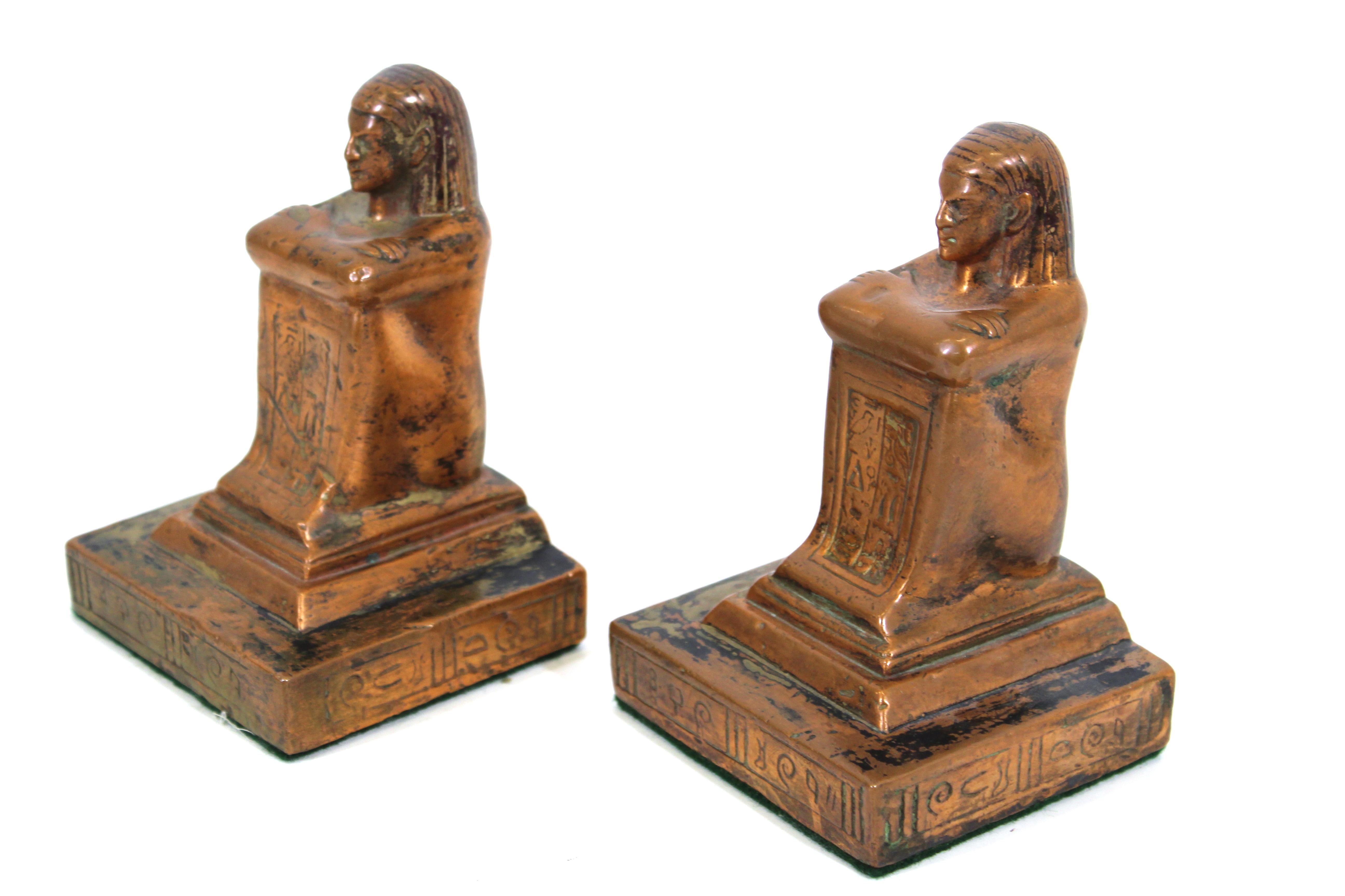 Egyptian Revival style pair of figurative bookends in weighted brass