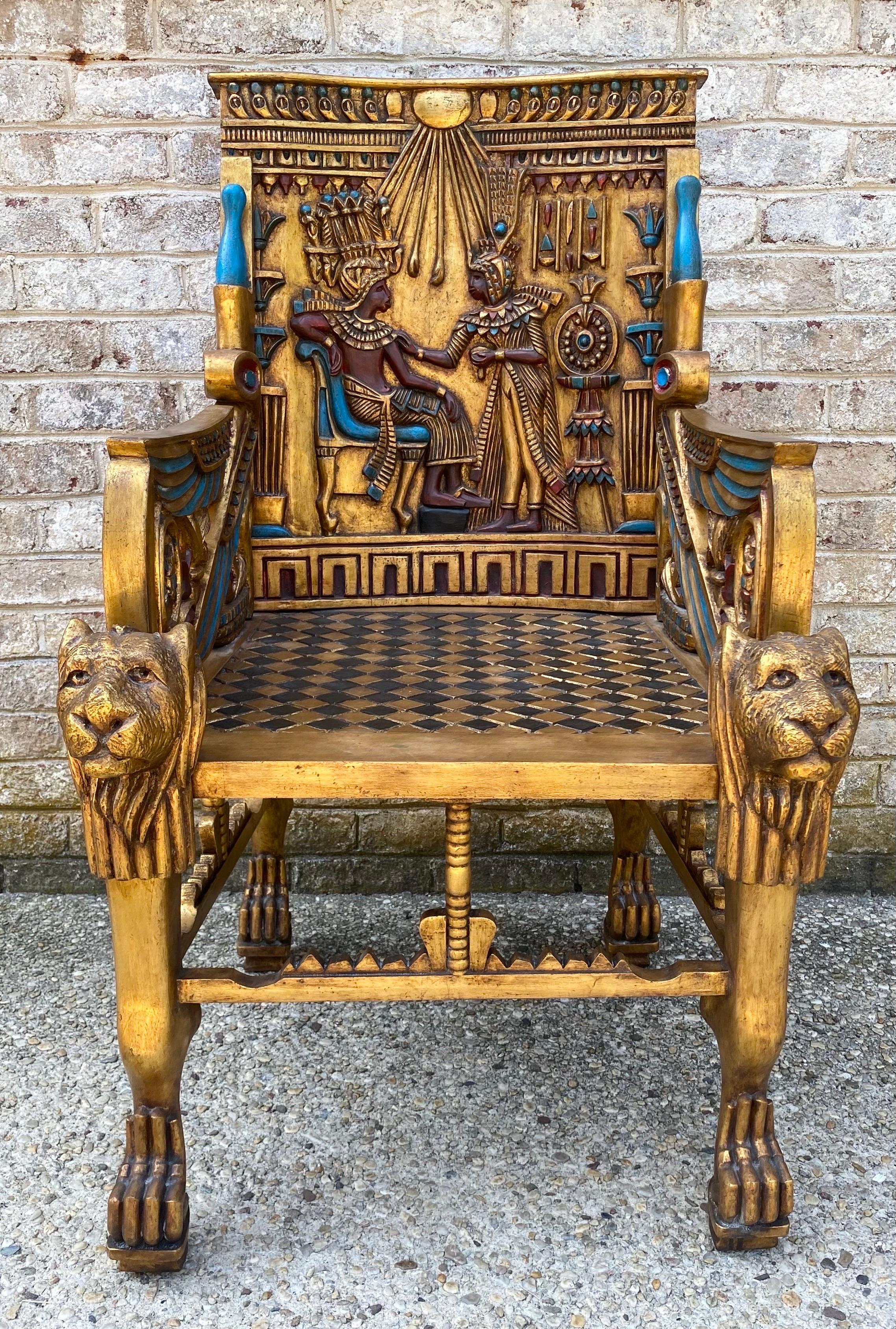 Fabulous Egyptian revival style carved, gilt, and painted throne-like chair.