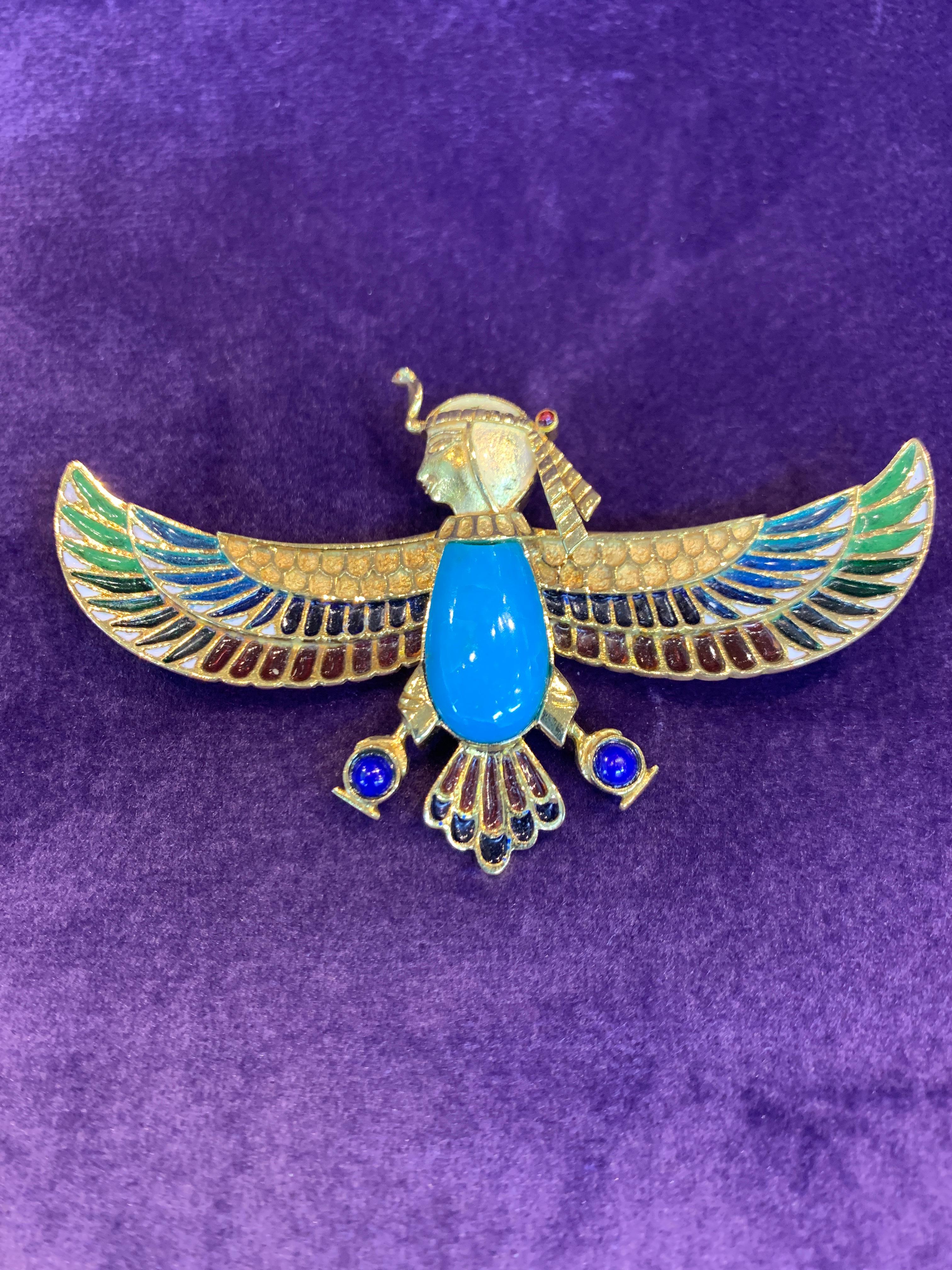 Egyptian Revival Turquoise sphinx Brooch with multi color plique a jour enamel 
Measurements: 3 inches long

Unidentified marker mark 