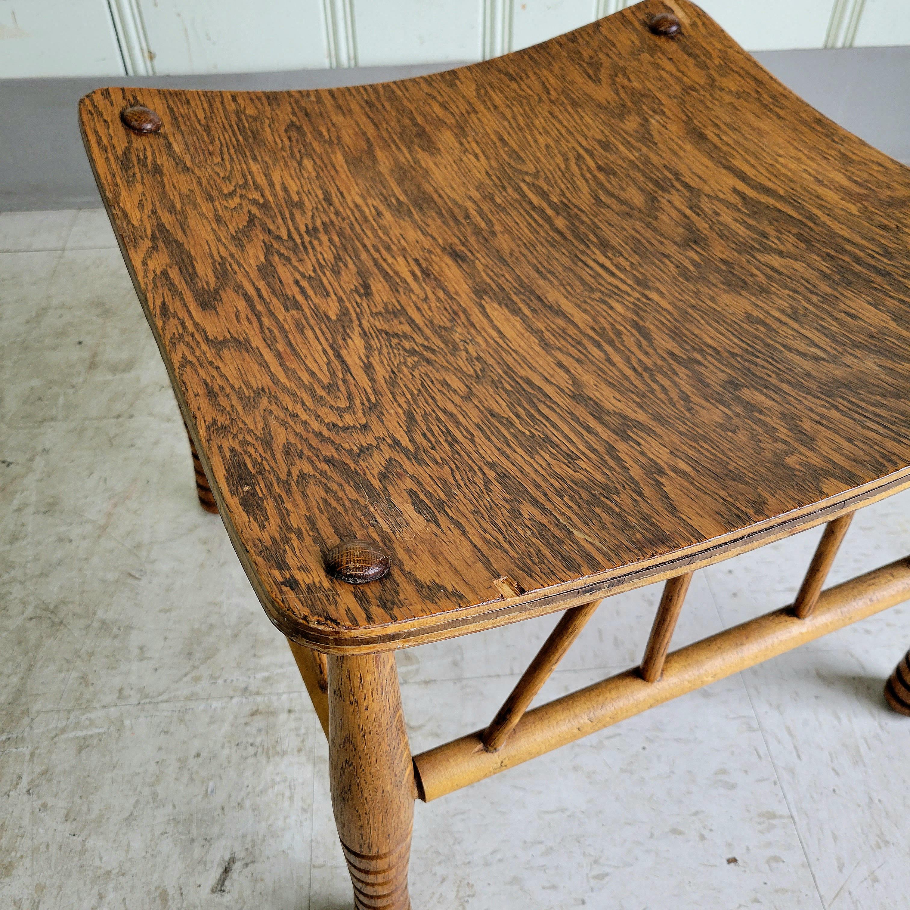 A very intricately designed and built stool. The sort of craftsmanship you don't see much of these days. Comprised of a mounded white oak ply shell and joinery at various, complicated angles. Dating from the 30s to the 40s this is a very well made