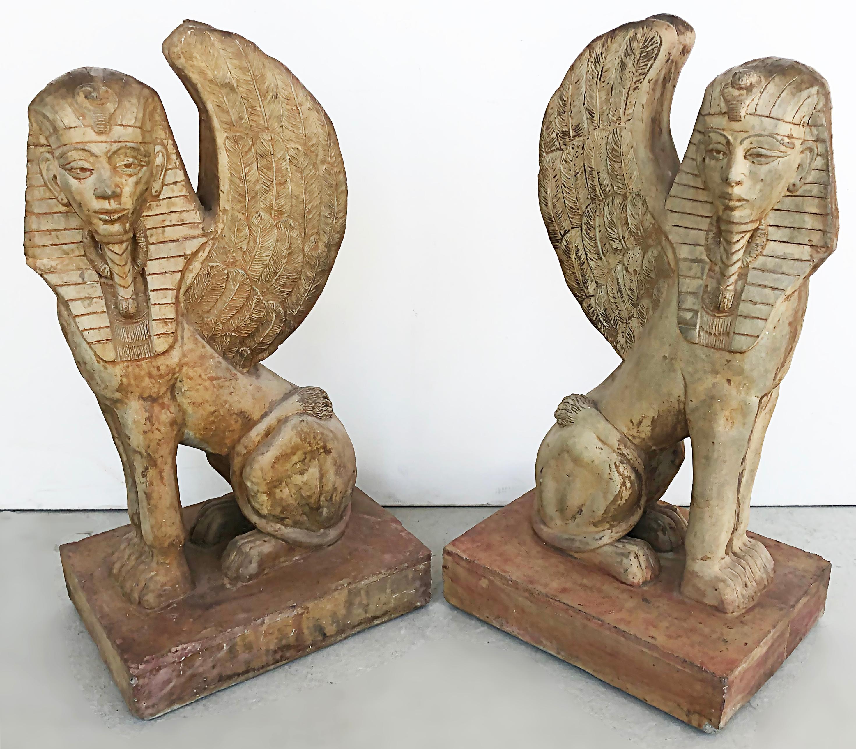 Egyptian Revival Winged Sphinx garden sculptures/ornaments, a pair

Offered for sale is a pair of Egyptian Revival-style winged sphinx garden sculptures/ornaments. The pair is opposing and will look great in a garden or guarding the front door.