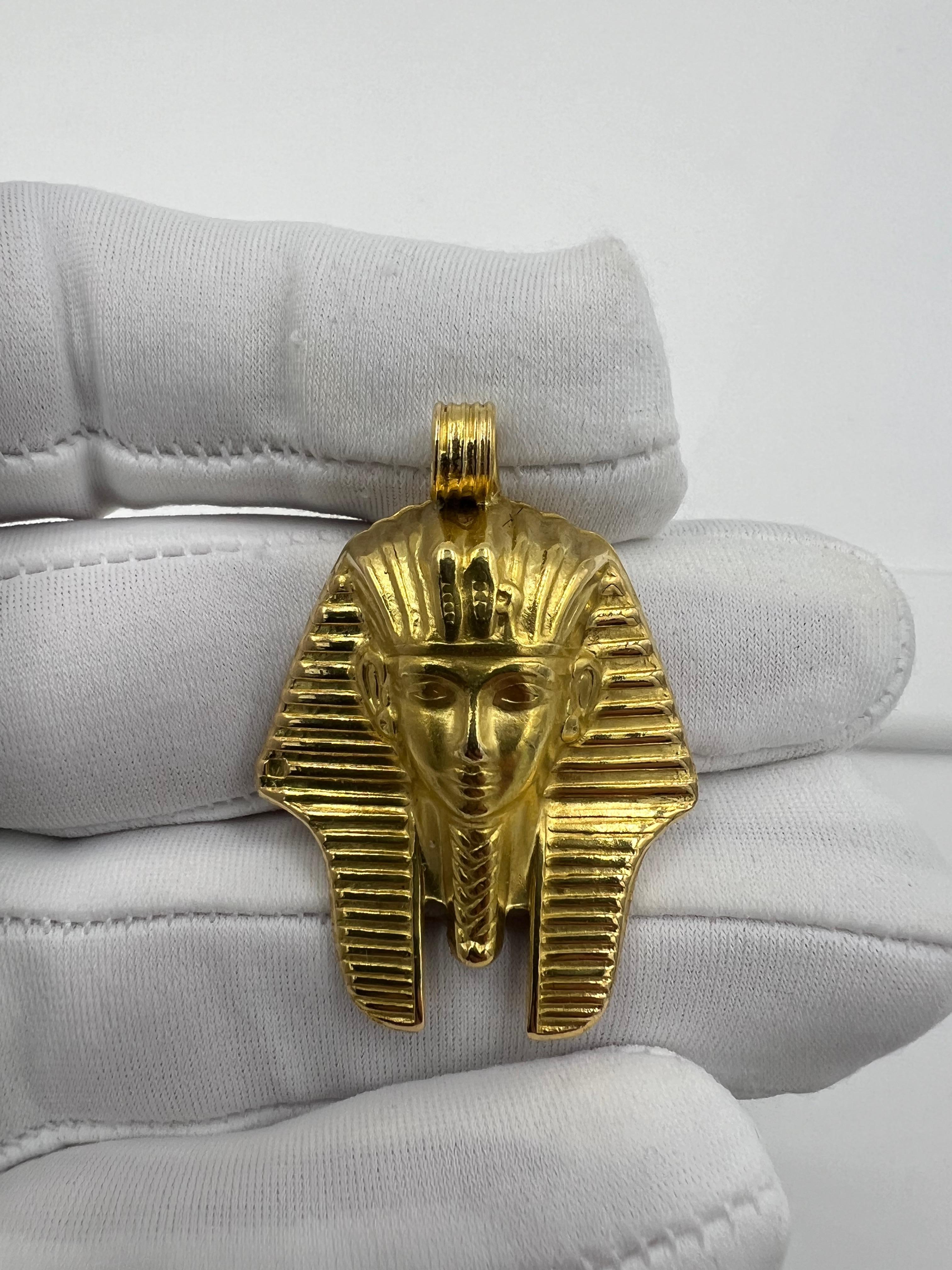 Egyptian Revival Yellow Gold Pendant

ABOUT THIS ITEM: P-DJ1030I  This Egyptian Revival Yellow Gold Pendant Of King Tut is a stunning piece of jewelry that not only embodies the rich history and culture of ancient Egypt but also serves as a timeless
