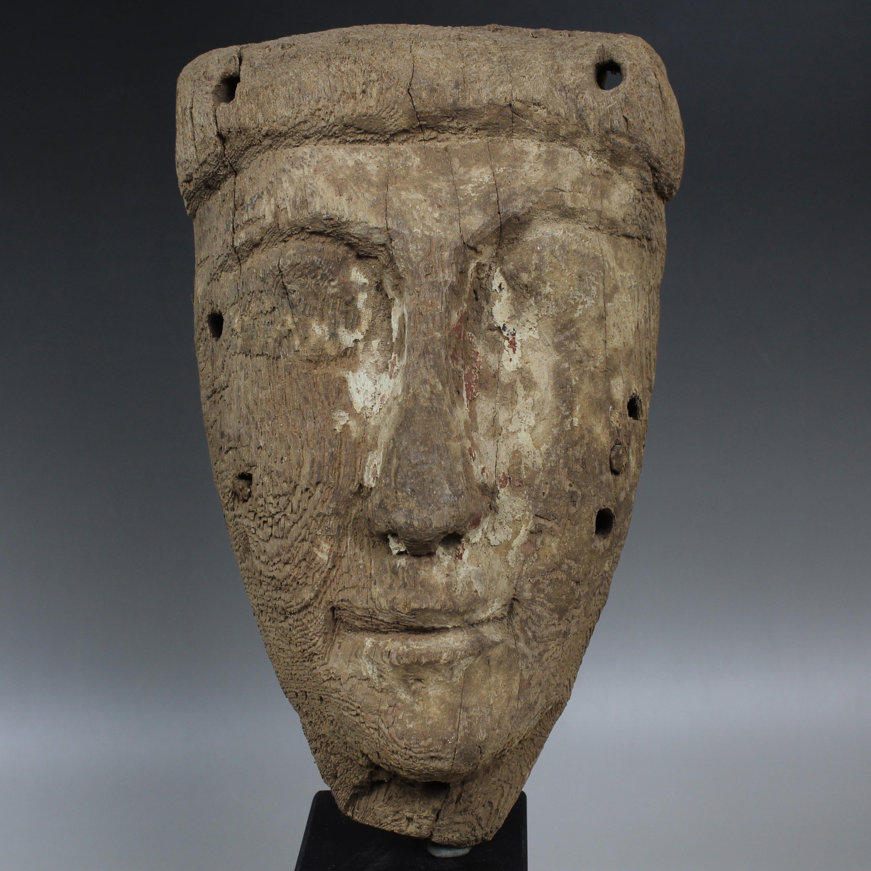 ITEM: Sarcophagus mask
MATERIAL: Wood
CULTURE: Egyptian, Late period
PERIOD: Late Period, 664 – 332 B.C
DIMENSIONS: 205 mm x 130 mm
CONDITION: Good condition
PROVENANCE: Ex French private collection, acquired between 1970 – 1990

Comes with