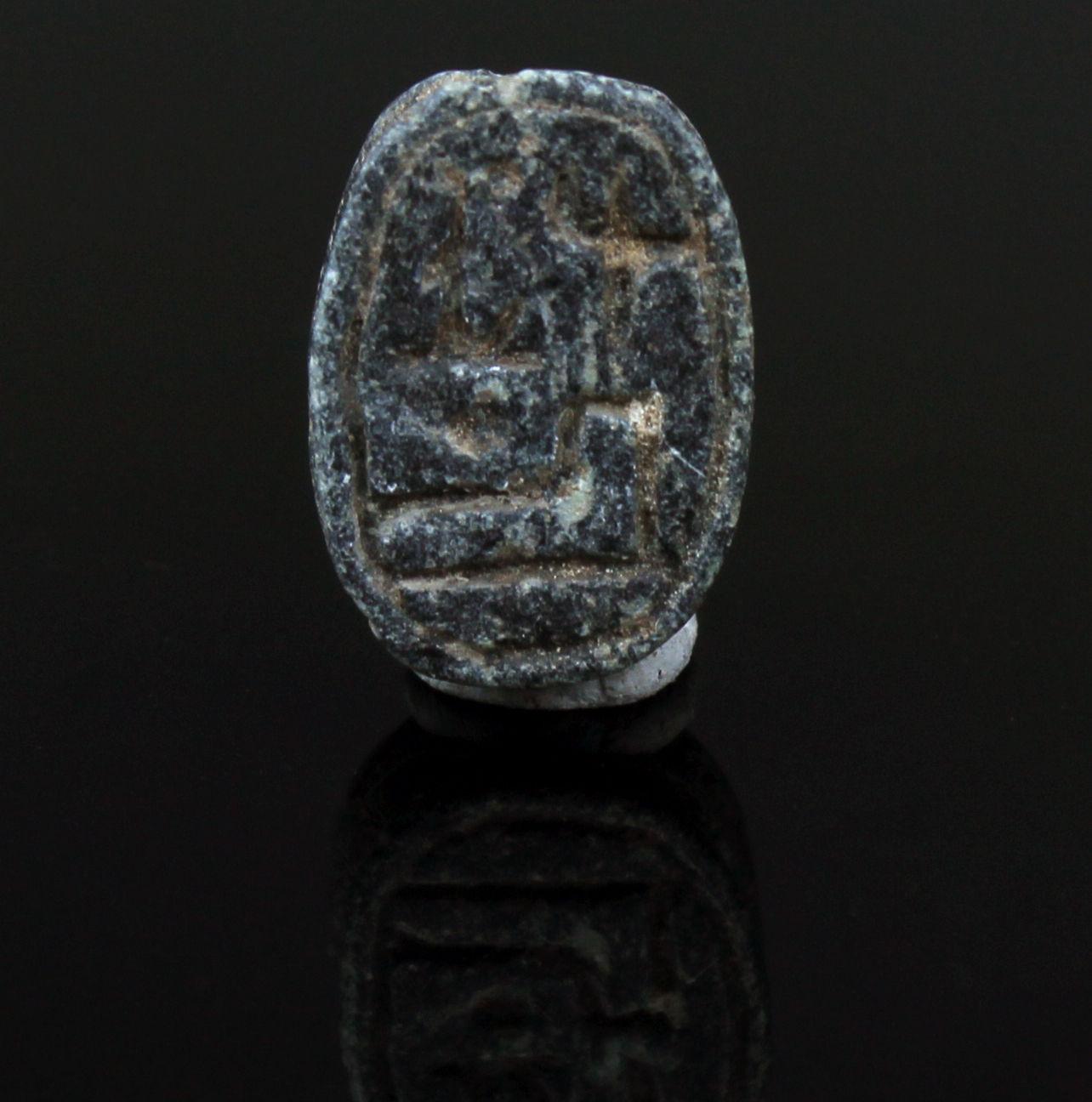 ITEM: Scarab as a commemorative of Ramesses II or prenomen of Shoshenq III
MATERIAL: Black steatite
CULTURE: Egyptian
PERIOD: New Kingdom to Third Intermediate Period, 1279 – 664 B.C
DIMENSIONS: 15 mm x 10 mm
CONDITION: Good condition
PROVENANCE: Ex