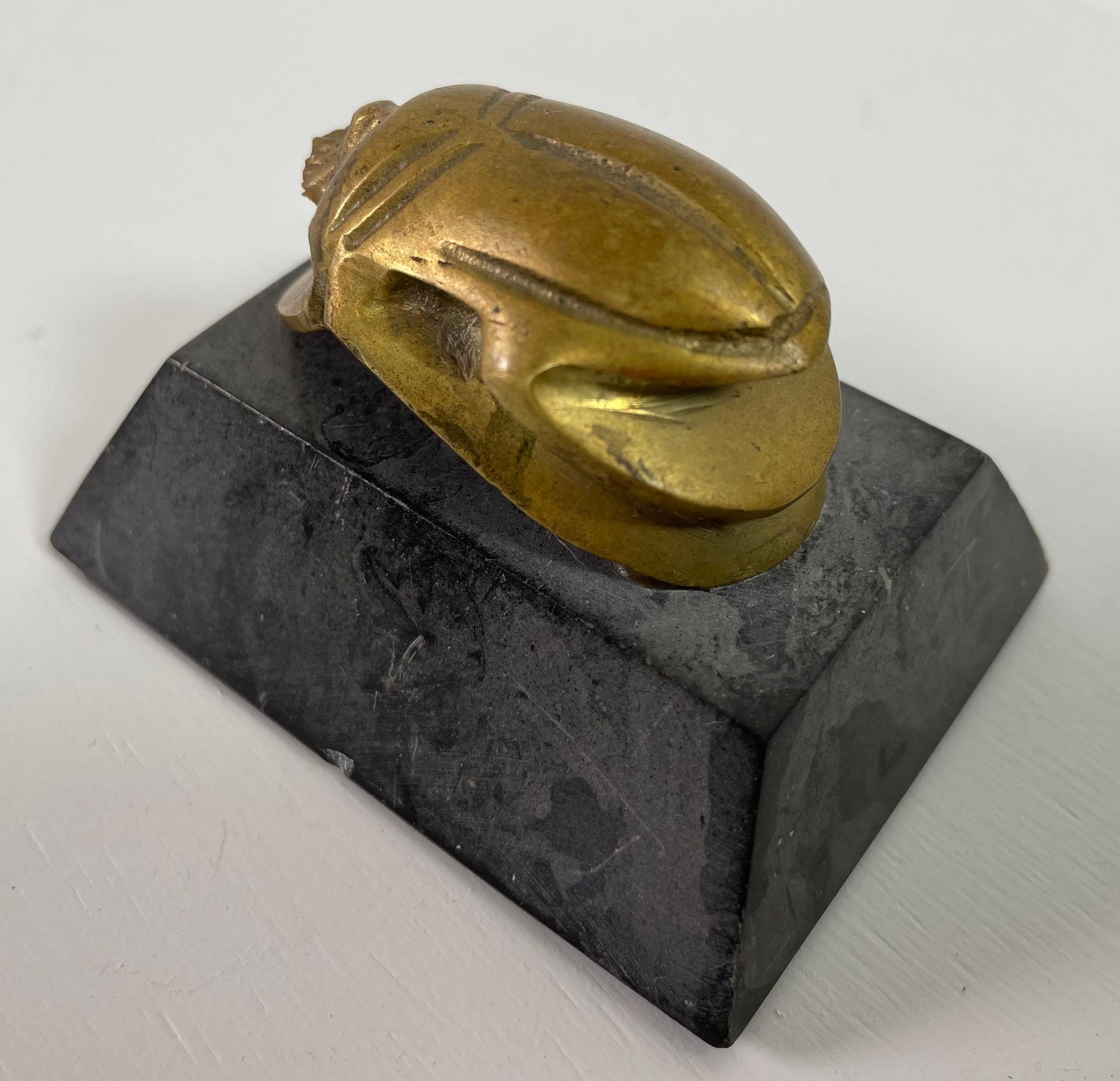 Cast Egyptian Scarab Brass Beetle Figurine on Black Stone Stand For Sale