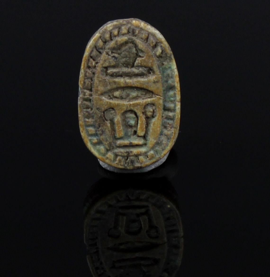 ITEM: Scarab
MATERIAL: Glazed steatite
CULTURE: Egyptian
PERIOD: Second Intermediate Period, 1700 – 1550 B.C
DIMENSIONS: 14 mm x 8 mm
CONDITION: Good condition
PROVENANCE: Ex American egyptologist collection, active in the early part of the 20th
