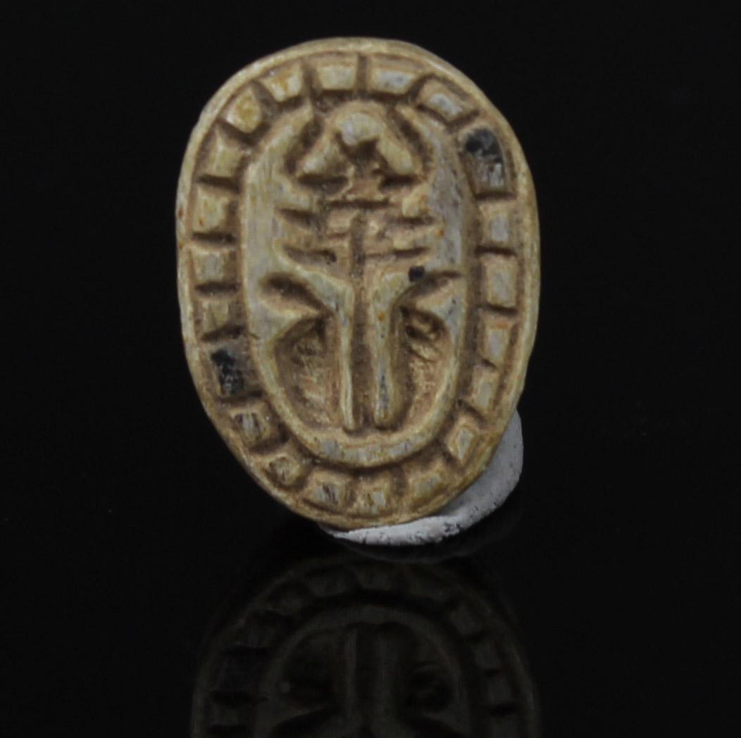 ITEM: Scarab with Hathor-sistrum with uraeus-terminals and robe border
MATERIAL: Steatite
CULTURE: Egyptian
PERIOD: Second Intermediate Period, 1700 – 1550 B.C
DIMENSIONS: 9 mm x 14 mm
CONDITION: Good condition
PROVENANCE: Ex American egyptologist