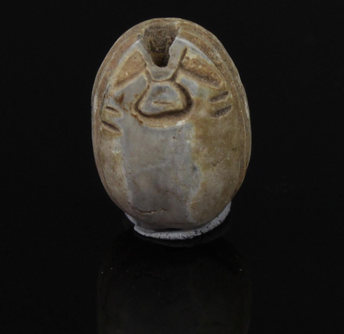 Stone Egyptian scarab with Hathor-sistrum with uraeus-terminals and robe border