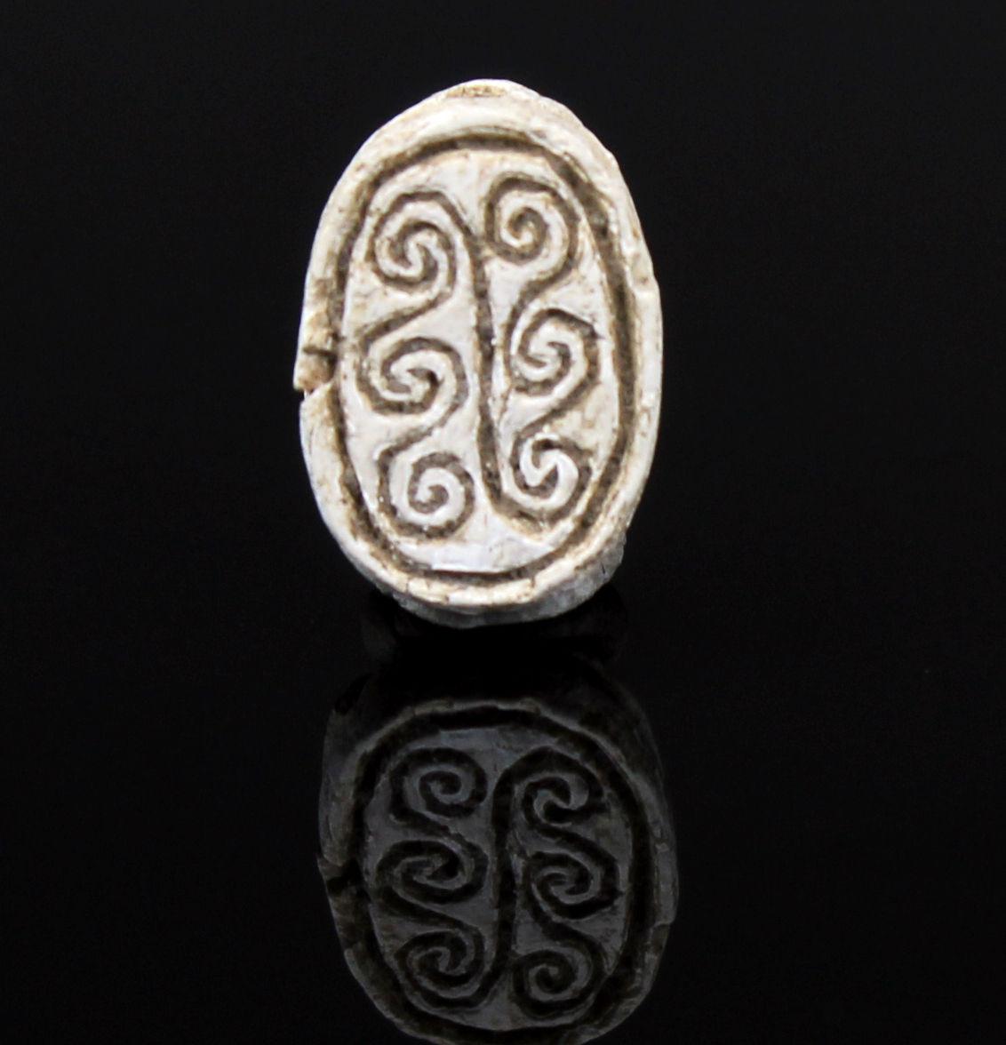 ITEM: Scarab with spiral design
MATERIAL: Steatite
CULTURE: Egyptian
PERIOD: Second Intermediate Period, 1700 – 1550 B.C
DIMENSIONS: 12 mm x 9 mm
CONDITION: Good condition
PROVENANCE: Ex American egyptologist collection, active in the early part of