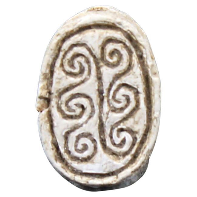 Egyptian scarab with spiral design
