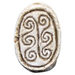 Used Egyptian scarab with spiral design
