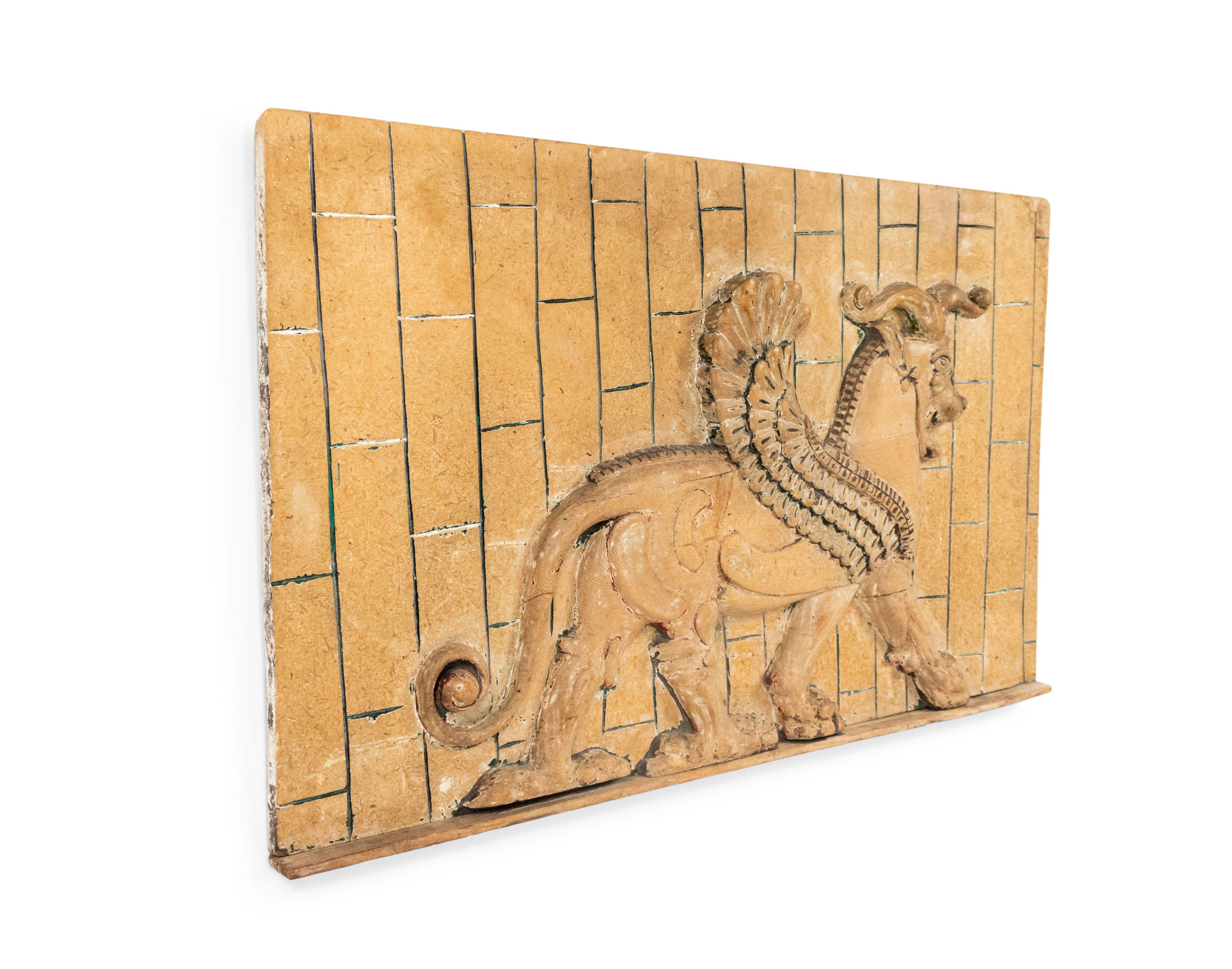 20th Century Egyptian Style Carved Wooden Wall Plaque of a Winged Bull For Sale