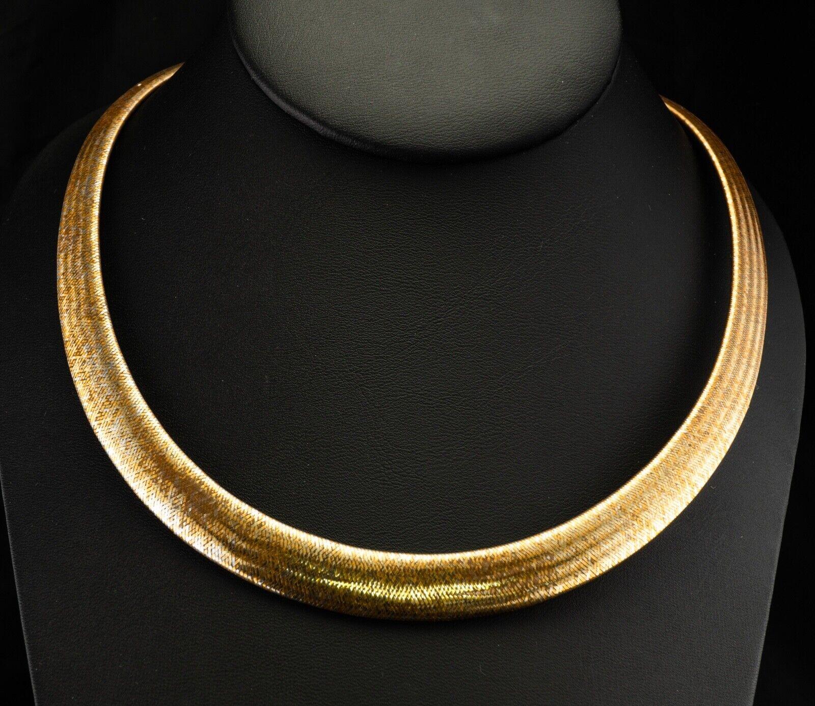 Egyptian Style Necklace Choker 14K Gold Italy

This gorgeous estate necklace / choker is made in Italy and crafted in solid 14K Yellow Gold. The choker is flexible and it measures 11mm in the center and gradually narrows to 6mm on the back. The