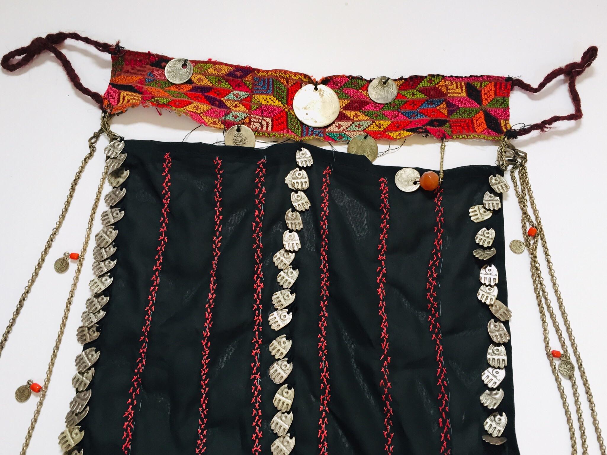 Middle Eastern Bedouin women face veil, from the Bedouin tribes of the Sinai Desert.
An amazing Niqab, Negev Bedouin veil from Palestine.
Worked on a base of tiny silk embroidery with antique Ottoman nickel silver coins, glass beads, wool,