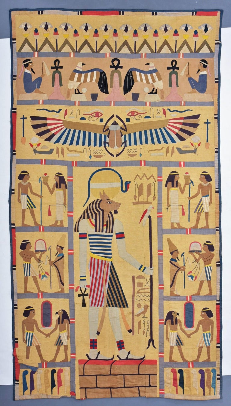Circa 1890 - 1920
France

Rare Belle Epoque hanging in Egyptomania, cotton work applied on a grey linen background. Drawing with compartments of the Egyptian mythology, representing hieroglyphs and zoomorphic divinities of which Isis and Osiris,