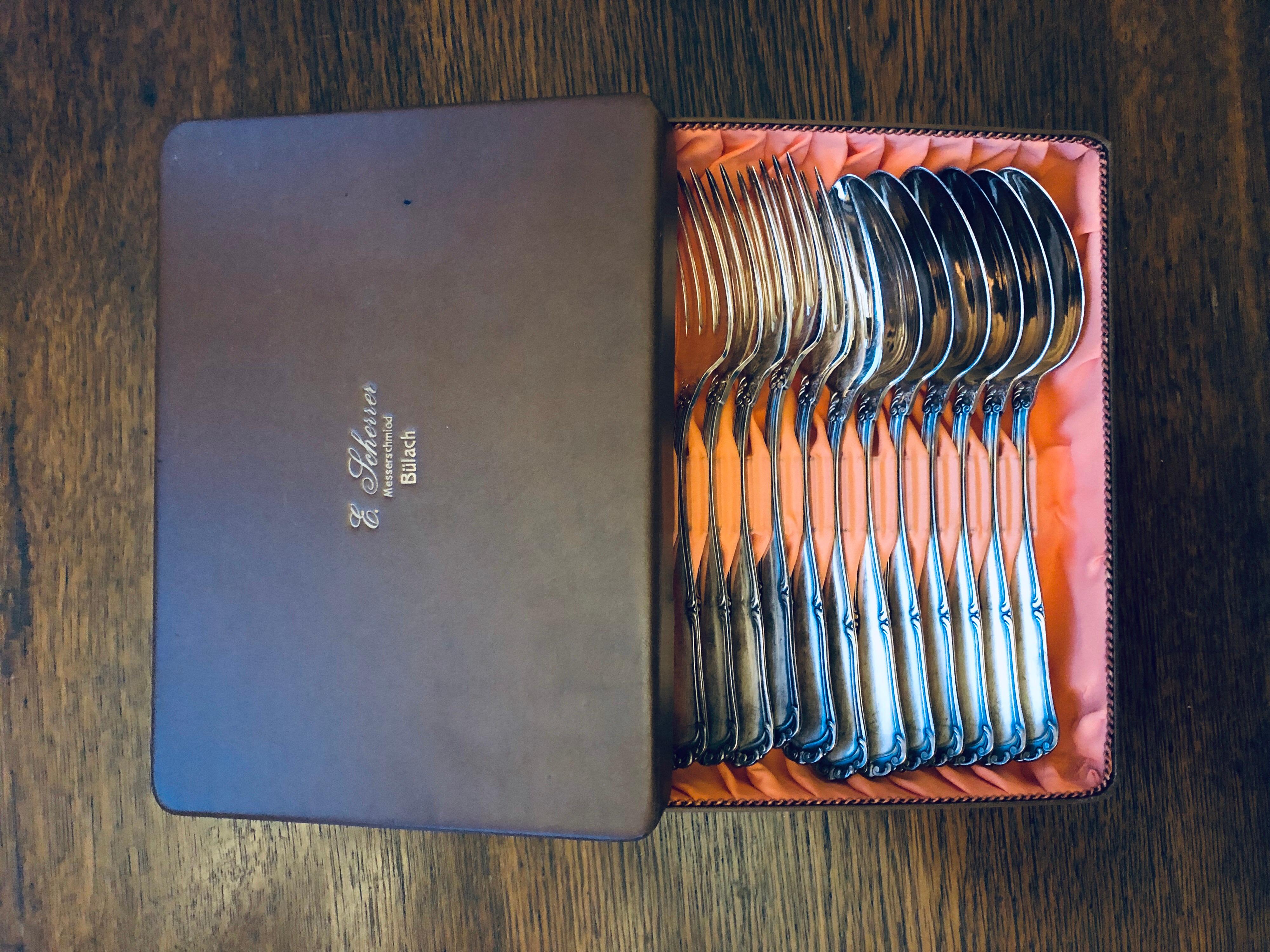 ON SALE 
E.Icherrer Messerschmied Bulach flatware silver set of 12 spoons forks in an original box.