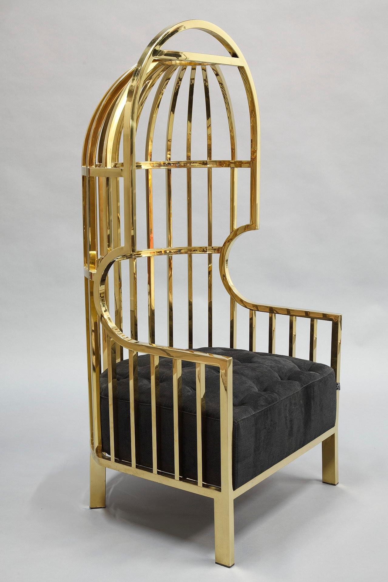 Astonishing Bora Bora chair with gold finished stainless steel cage featuring a velvet quilted button black seat pad. Combining luxury and glamour, this high-end chair is a modern translation of famous Classic designs. Its design is inspired by the
