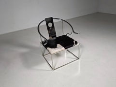 EICHHOLTZ Poltrona scultorea in acciaio inossidabile e pelle di mucca, anni '90