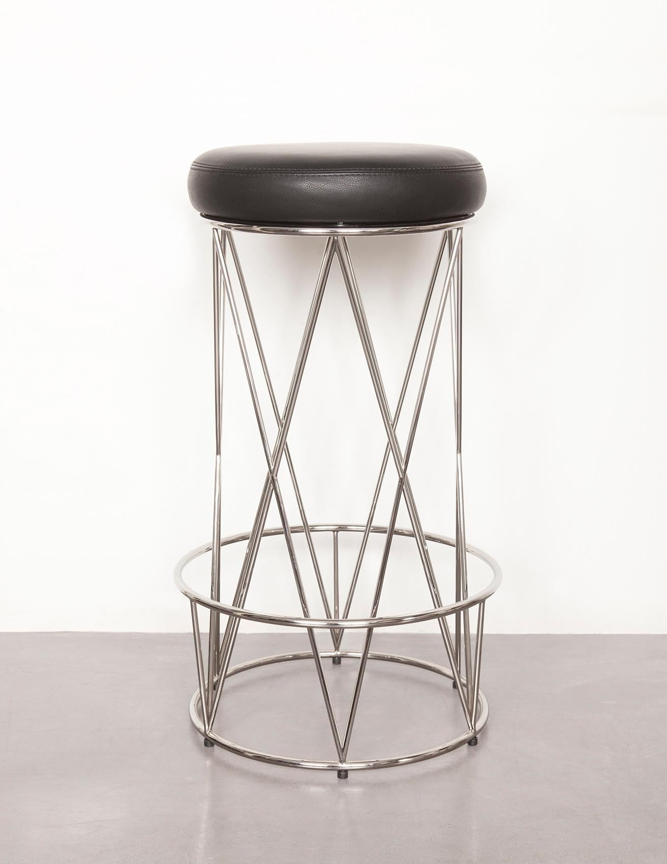 From the Eiffel line, this stool combines aesthetics and comfort, with a crossed polished stainless steel base and a soft, full-grain leather seat 
Polished stainless steel structure, Upholstered leather seat.