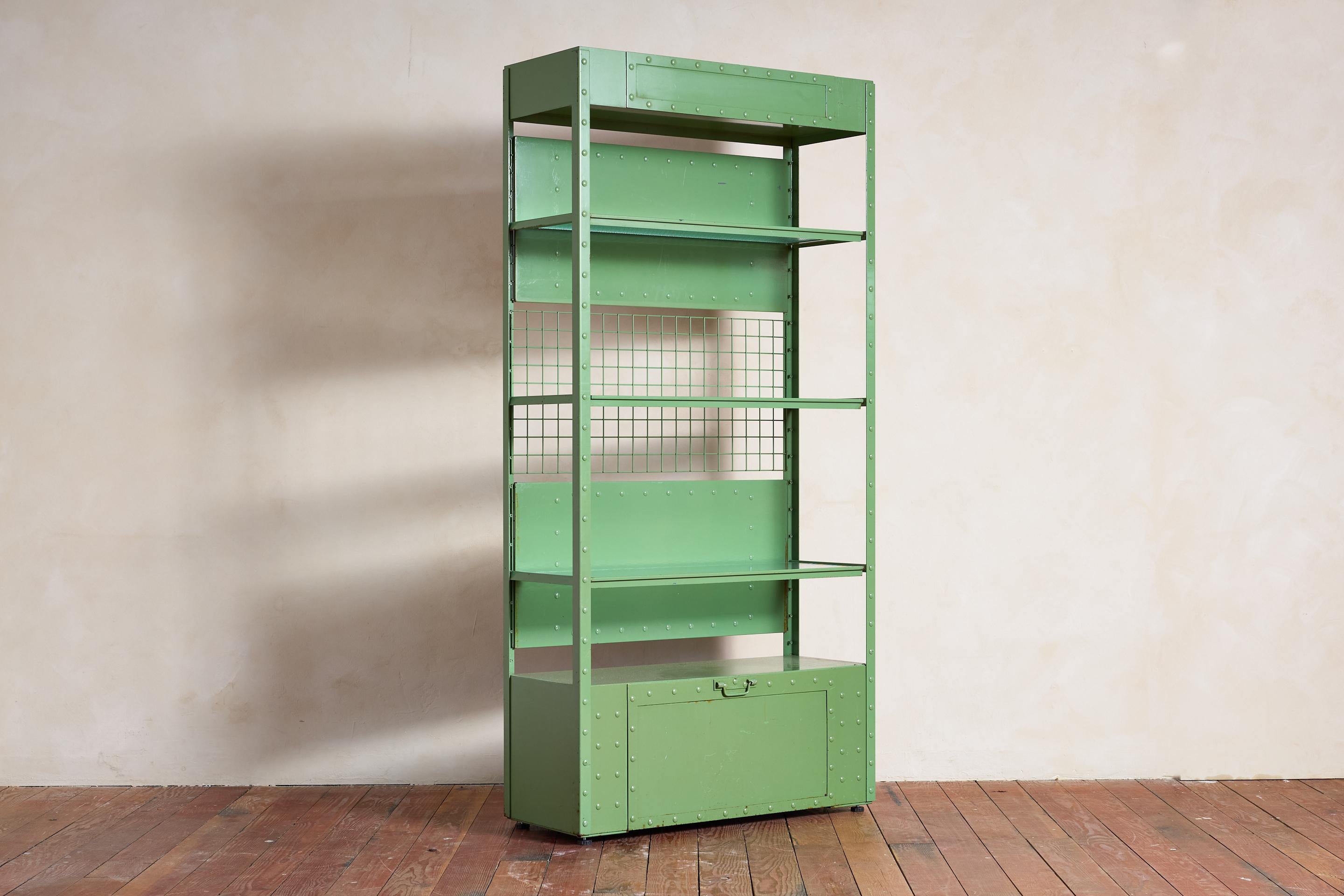 A rare find from the souvenir boutique of the Eiffel Tower! 

Chic green lacquered iron vitrine, adorned with rivet detailing, original etched glass shelves, storage compartment at the bottom and removable grid panels

Incredible piece - total of 3