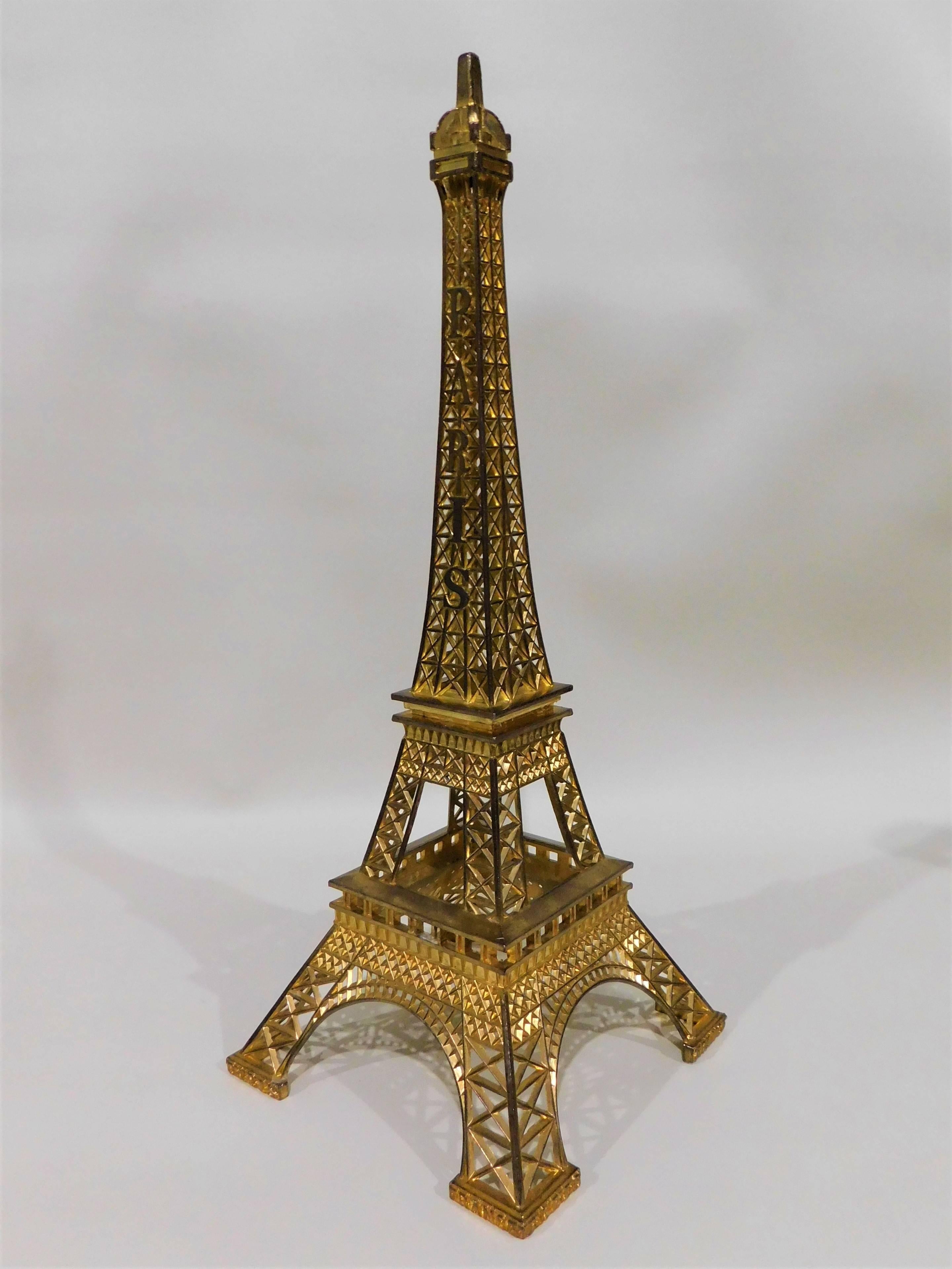 Eiffel Tower Paris France with gilt metal display stand model souvenir. Nice architectural copy.

Eiffel tower (French: La Tour Eiffel) was built in 1889 and is located on the Champ de Mars in Paris, France. Hollow structure tower, 300 meters