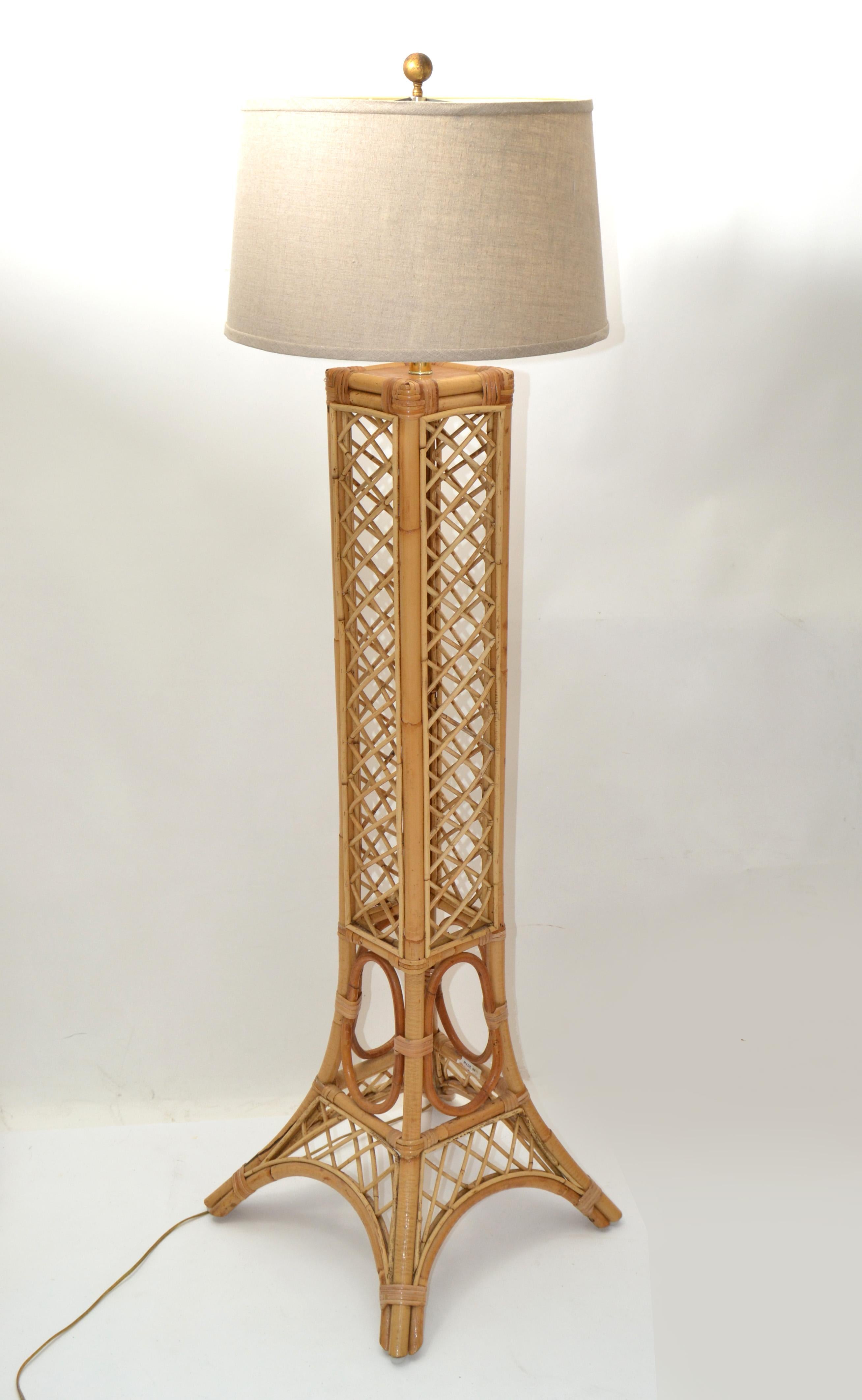 Handcrafted tall Mid-Century Modern Eiffel Tower Paris pencil reed, cane & bamboo floor lamp with Drum Shade.
It is wired for the U.S. and uses a regular or LED bulb. 
Bohemian chic design sculpture stunning addition for your sunroom.
Drum shade