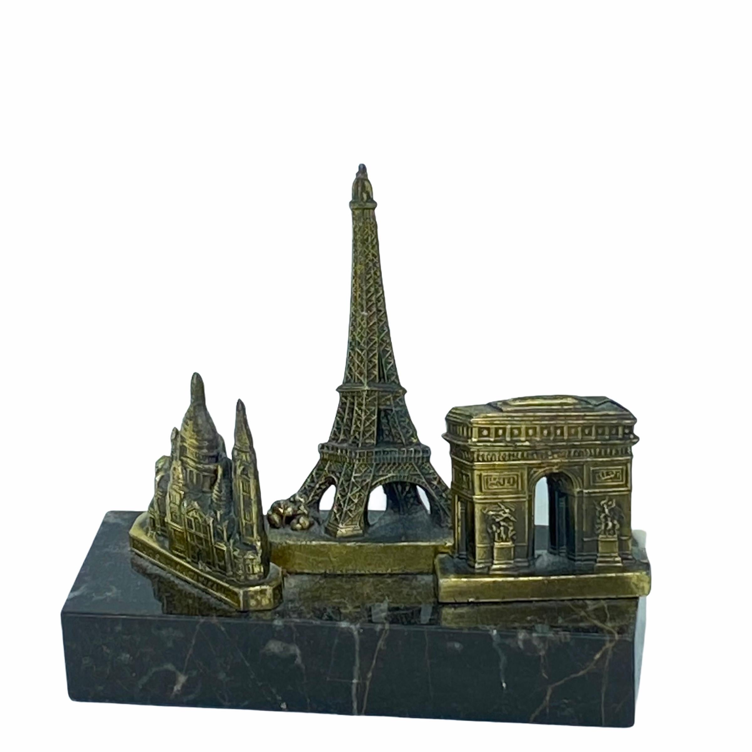 A decorative Eiffel Tower, Sacré-Coeur and Arc de Triomphe souvenir building sculpture. Some wear with a nice patina, but this is old-age. Made of metal and a marble base. This item was bought as a souvenir in Paris, France and was made probably in