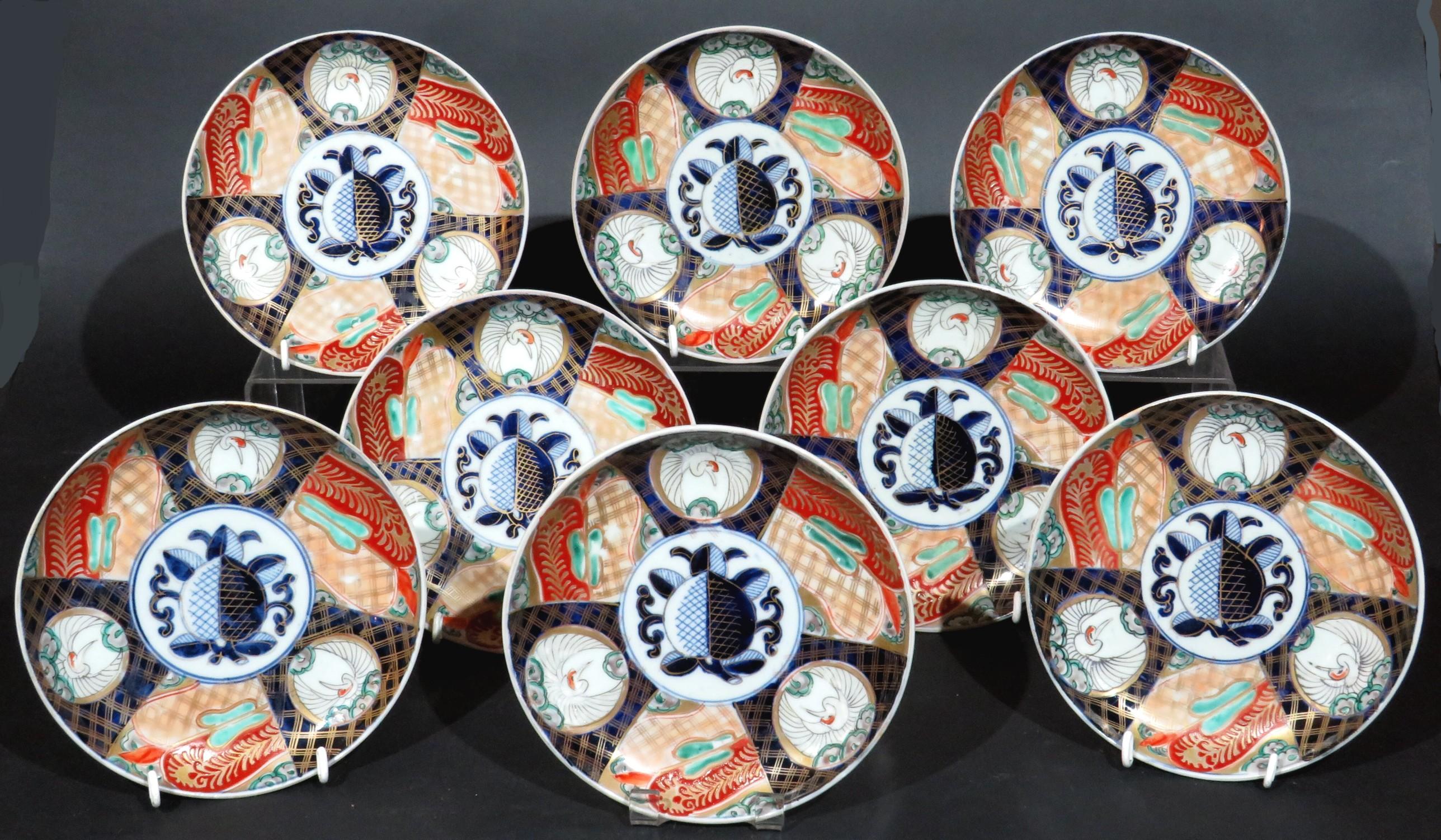 All richly decorated with hand painted enamels in a palette of cobalt, vermillion, green & & gilt, showing triangular panels of geometric designs interspersed by circular cartouches with egrets, radiating out from a central field with a stylized
