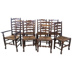 Eight '7 and 1' Antique English Oak Ladder Back Dining Chairs