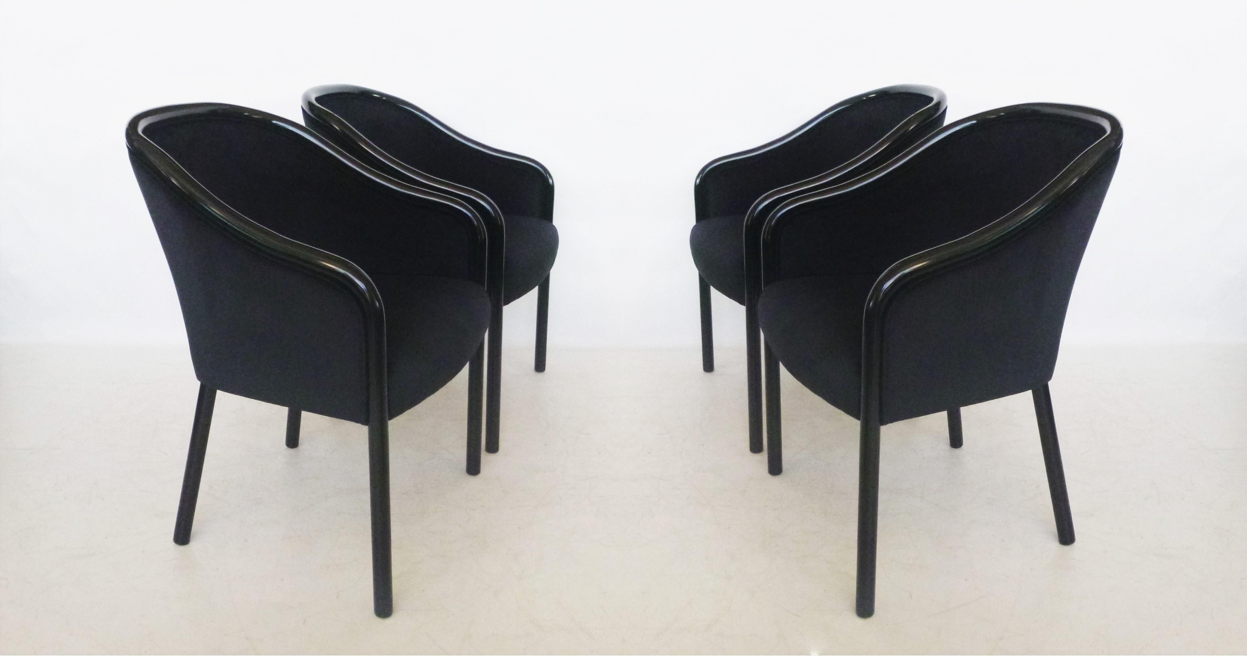 Set of eight all black Ward Bennett armchairs for Brickell Associates. Simple construction is all of solid wood. Newly lacquered frames, impeccably joined barrel-back and sloping arms that extend into the front legs. Upholstered in a luscious