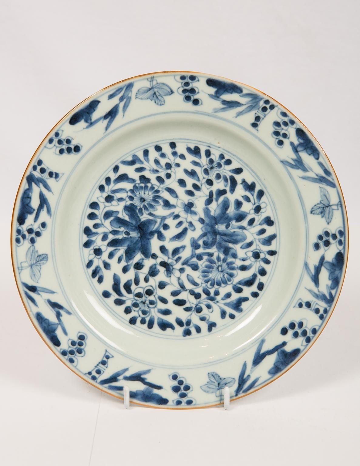 A group of eight beautiful Chinese blue and white porcelain dishes made in the 18th century during the Qianlong Reign, circa 1770. Made for export to Europe, the plates show a variety of beautiful floral patterns, all hand painted in cobalt
