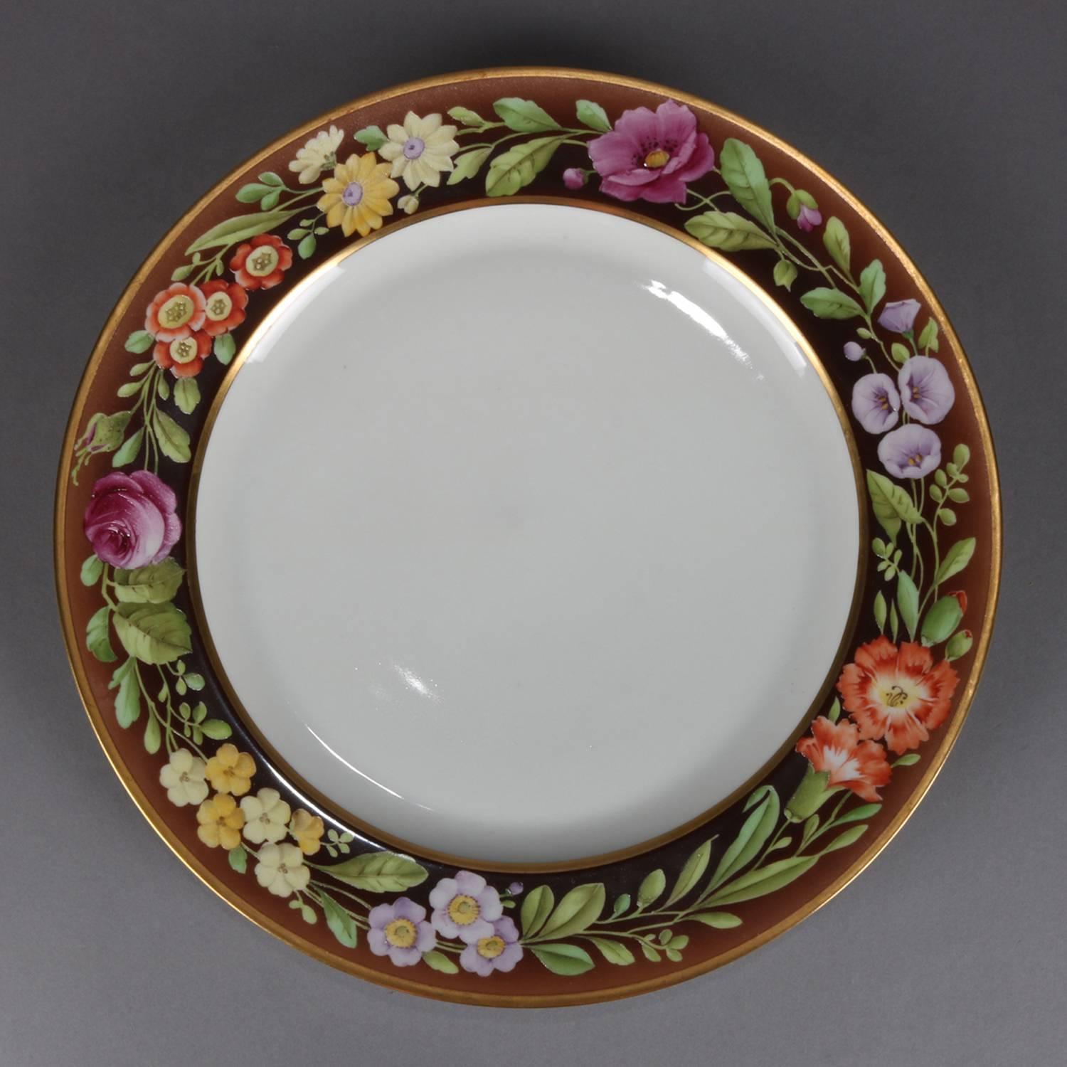 Set of eight German hand-painted Tirschenreuth fine china dinner pates feature floral rim with gilt highlights, en en verso Bavaria Tirschenreuth mark, circa 1900


Measures: 1