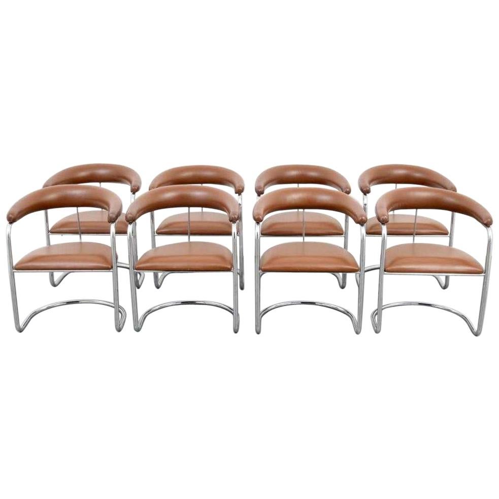 Set of eight armchairs designed by Anton Lorenz for Thonet. Each chair has tan upholstered backrest and seat with polished chrome tubular frames.

Mid-Century Modern S-37 chairs were originally designed by Anton Lorenz in 1929 and later