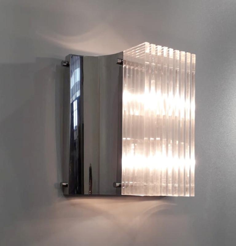 Italian mid-century Lucite wall lights mounted on polished chrome frames / Made in Italy circa 1960s
Can also be stacked to create a taller fixture
2 lights / E12 or E14 type / max 40W each
Height: 12 inches / Width: 13 inches / Depth: 7 inches
8 in