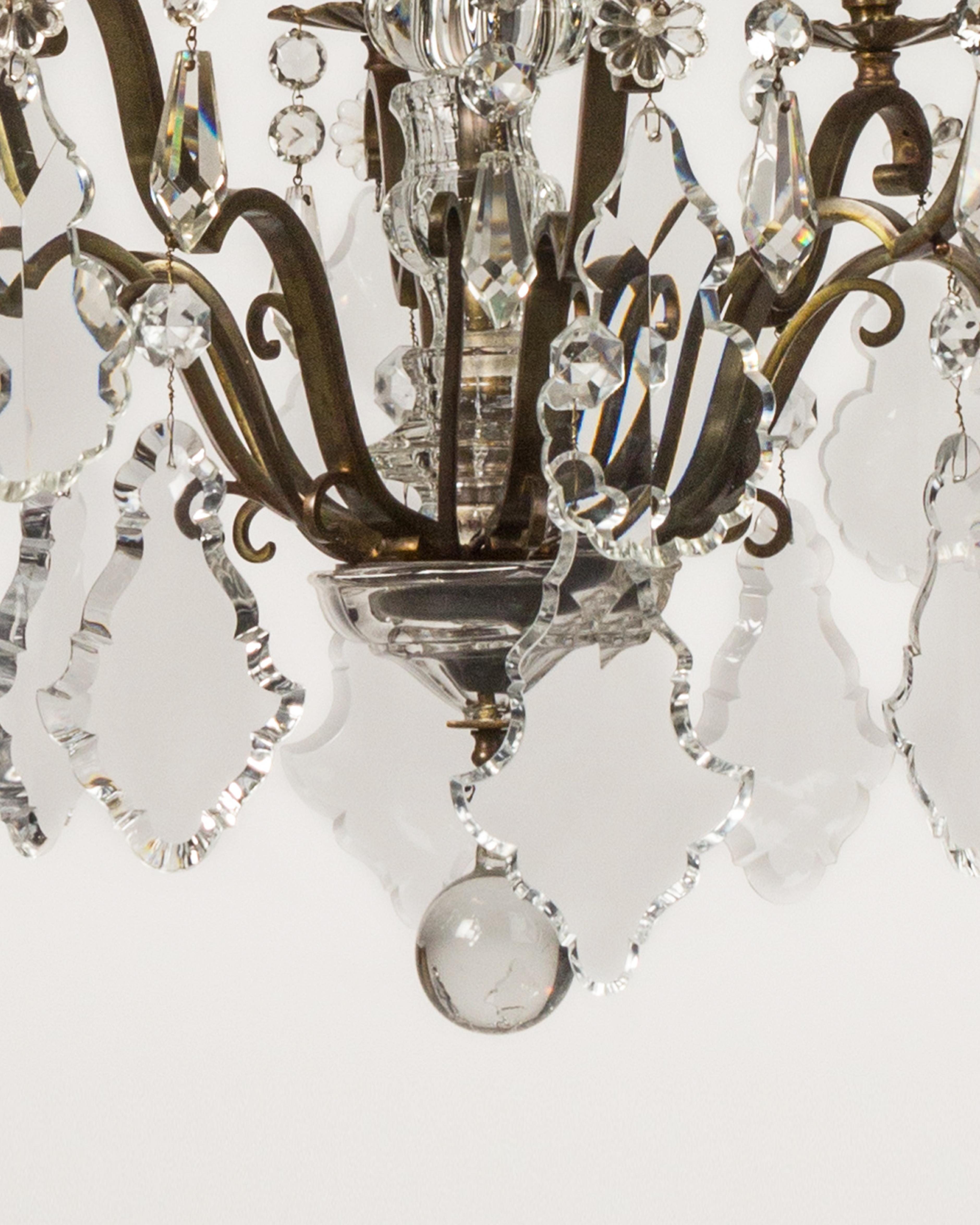 Eight Arm Brass and Glass Chandelier with Four Tiers of Faceted Crystal Prisms In Good Condition In New York, NY