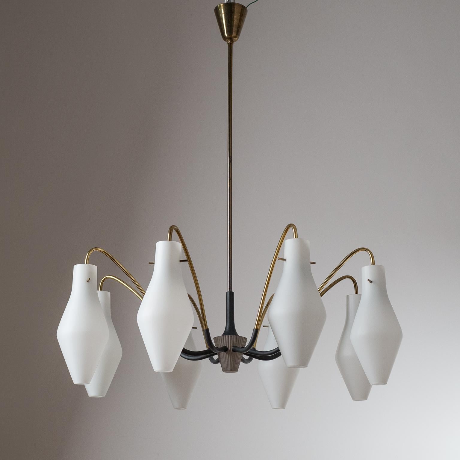 Fine mid-century 'spider' chandelier from Germany, 1950-1960s. A unique ribbed centerpiece from which eight brass arms curve out, each with a vase-shaped satin glass diffuser. Original brass E14 sockets with new wiring.