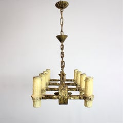 Eight-arm wrought iron lamp with a gilded finish and imitation candle holders -