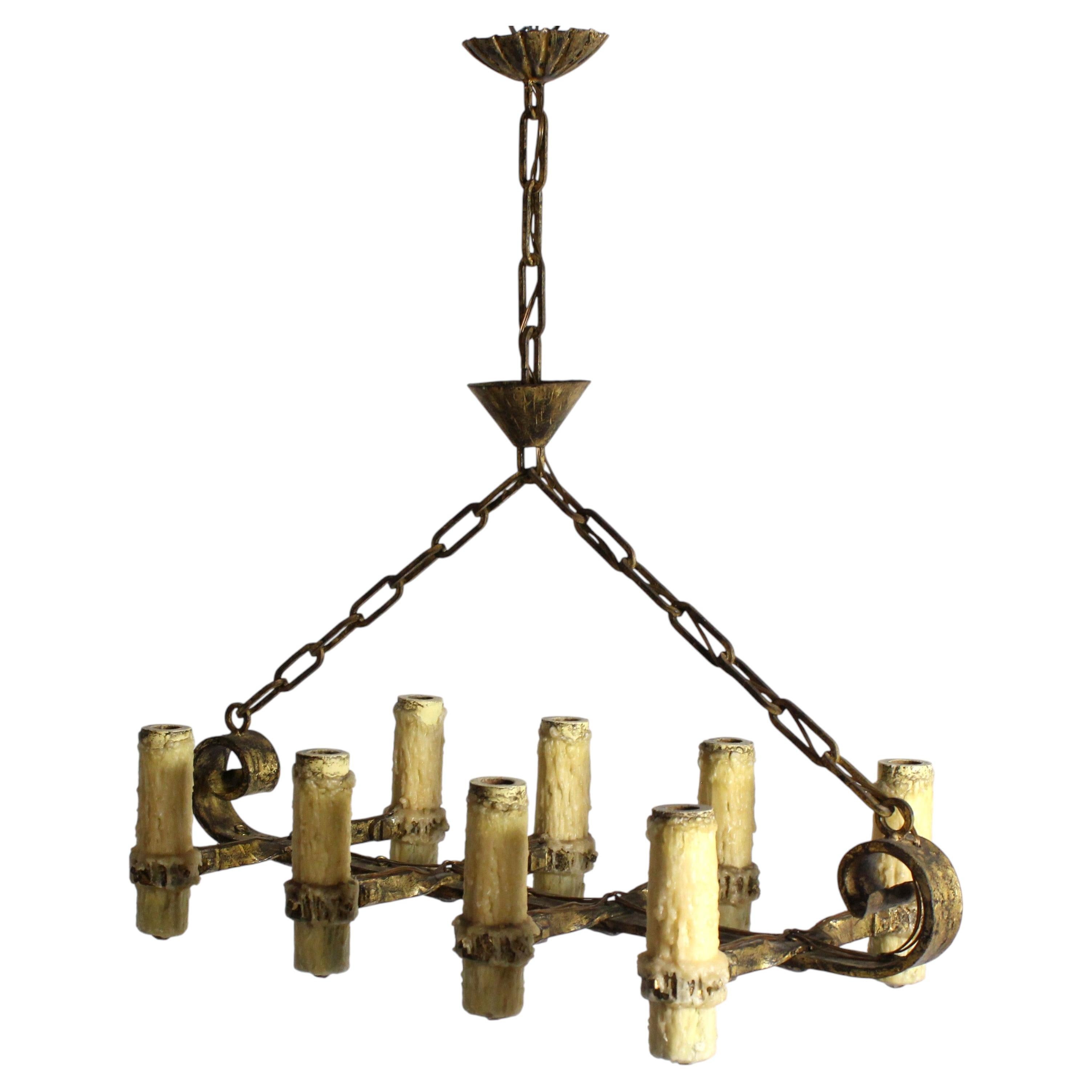 Eight-arm wrought iron lamp with a gilded finish and imitation candle holders - For Sale