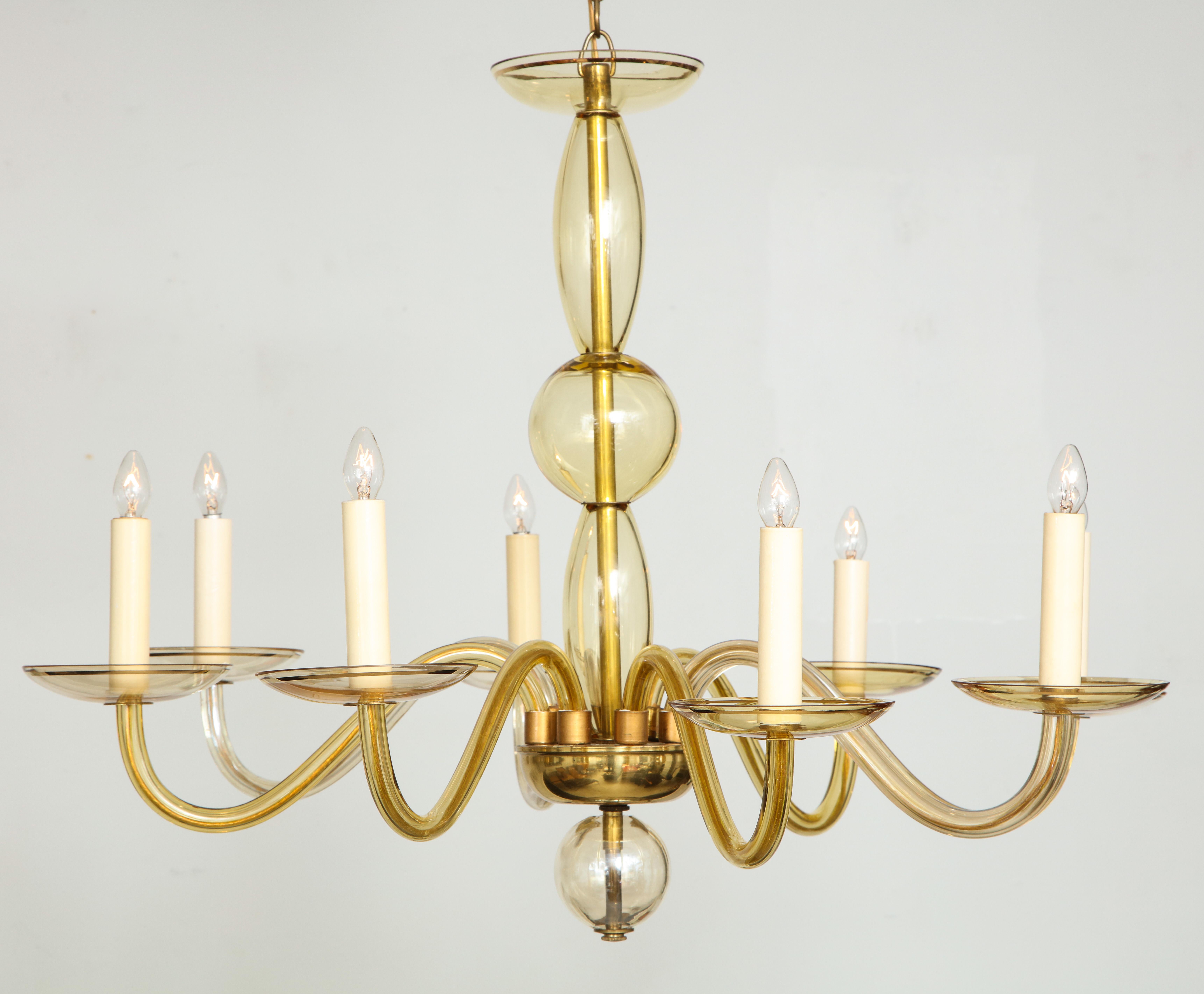 Eight- arms amber-colored Murano glass chandelier.