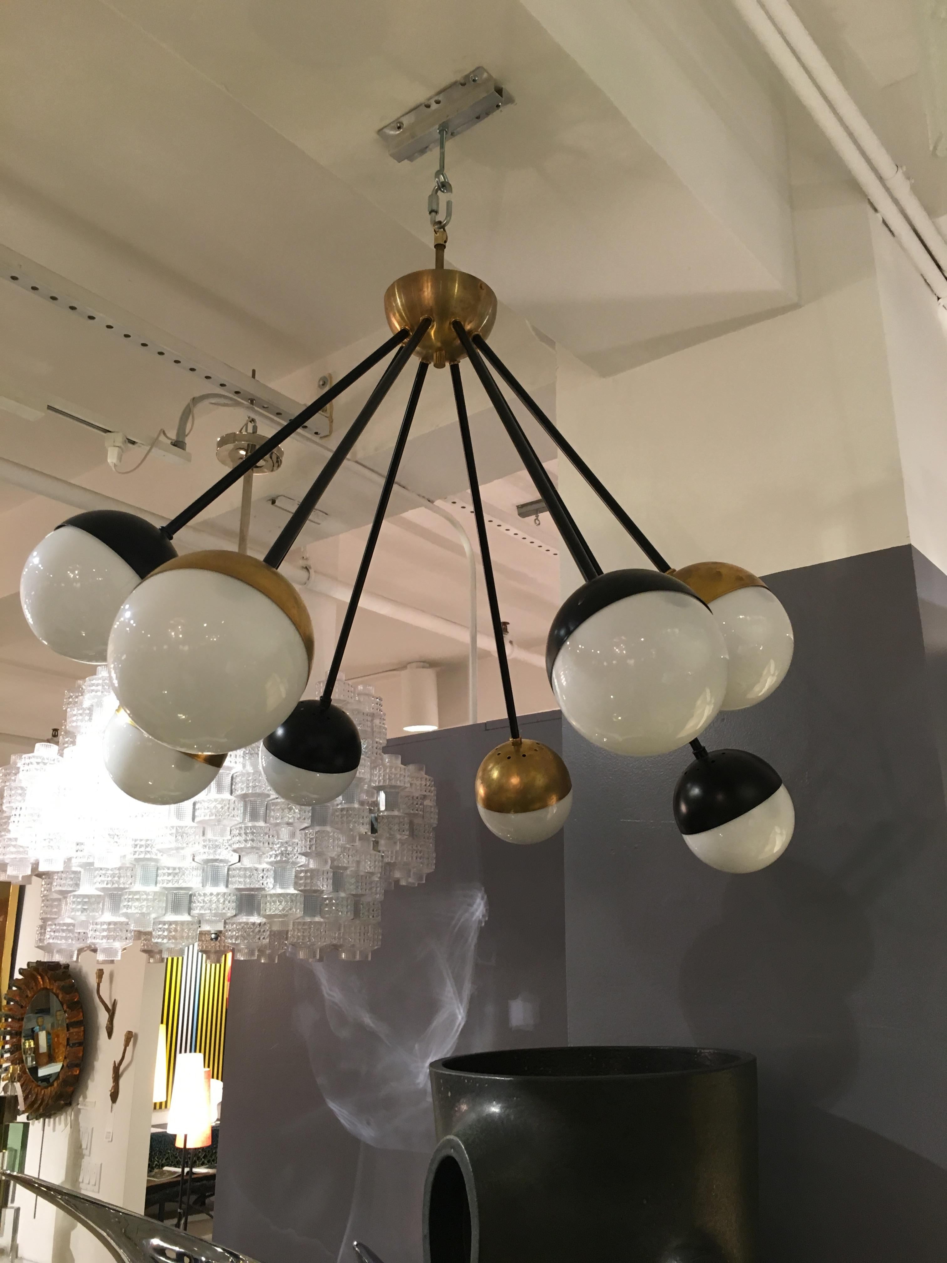 Italian Eight Brass and Black Arm Chandelier with Glass Globes by Stilnovo For Sale