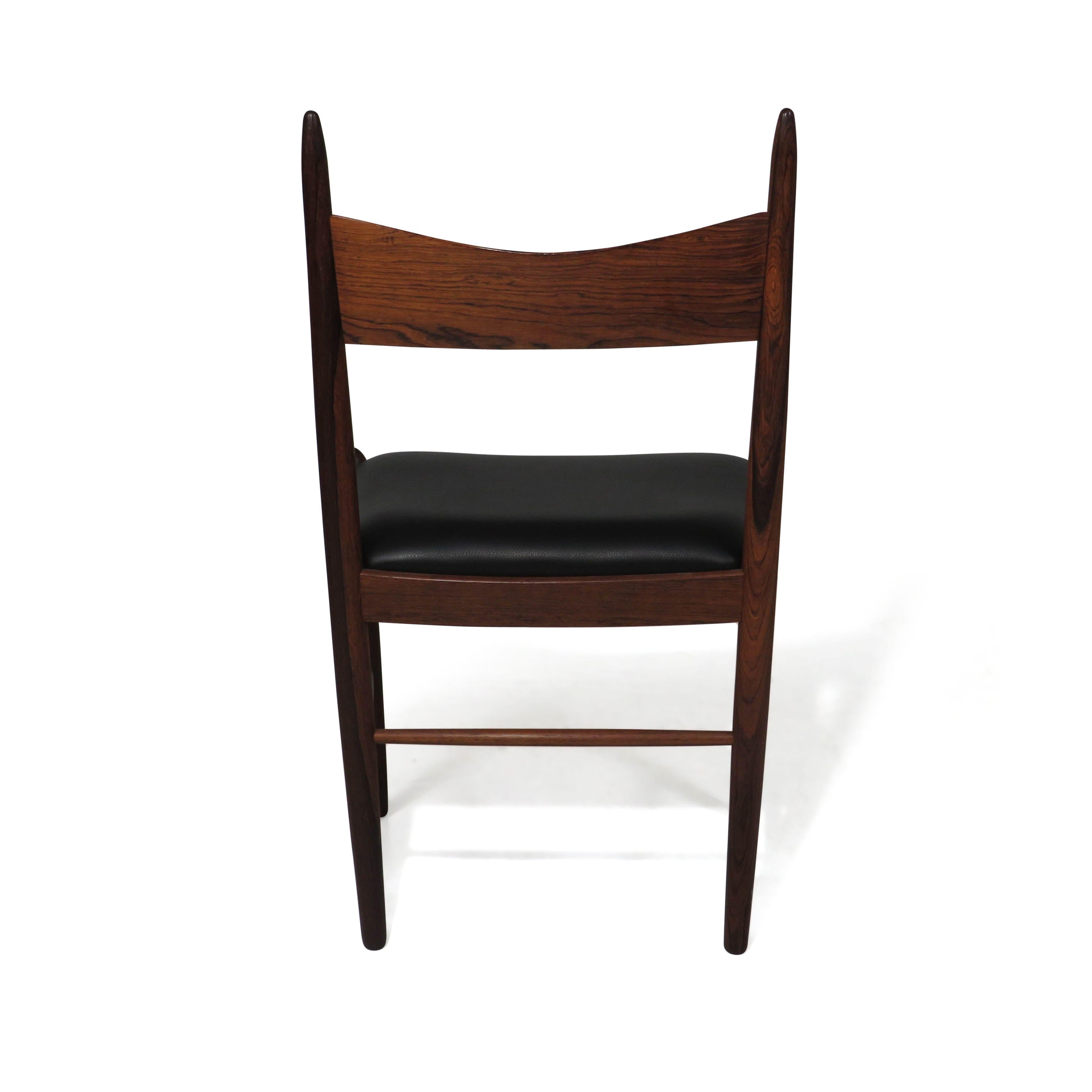 Eight Brazilian Rosewood Dining Chairs in New Black Leather 1