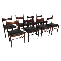 Eight Brazilian Rosewood Dining Chairs in New Black Leather