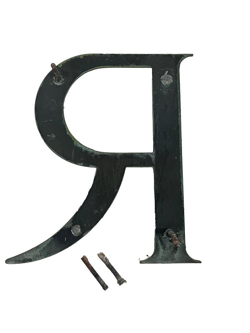 Eight bronze wall letters, ca 1910

Eight pieces of flat bronze letters painted in green, 30 cm high. Most have threaded pins at the back, but some will need to be restored. The following letters are present twice the letter E and only the letters